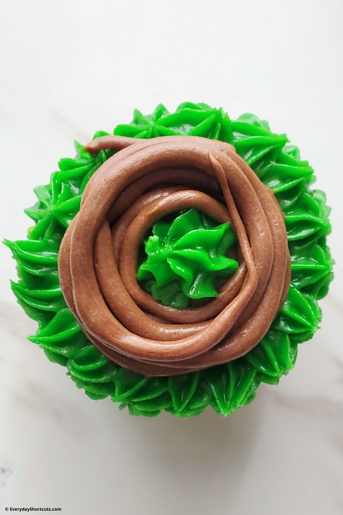 chocolate frosting on top of cupcake
