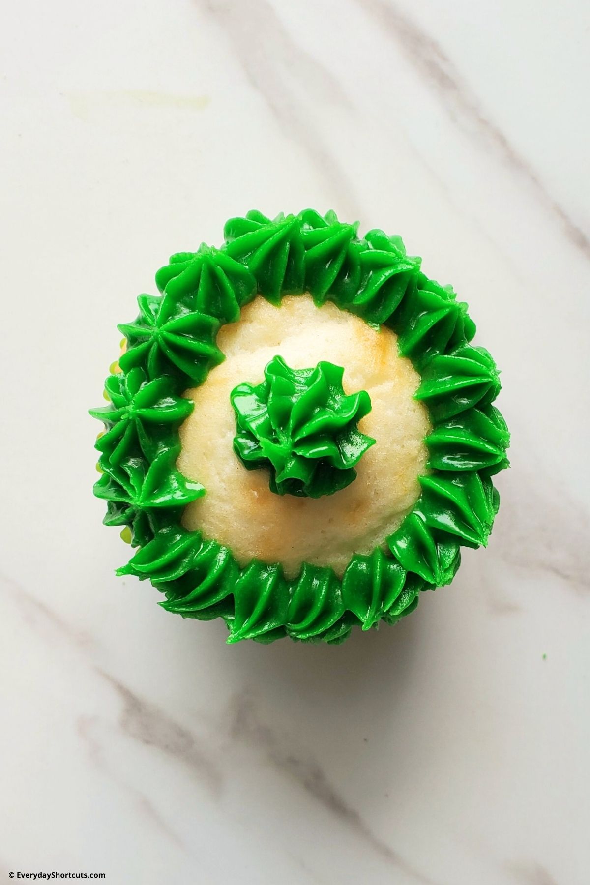 green frosting in a circle on a cupcake