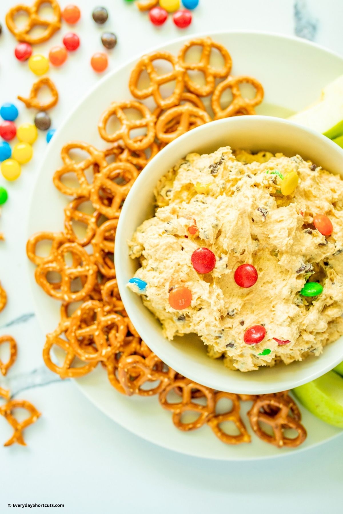 monster cookie dough dip in a bowl with pretzels
