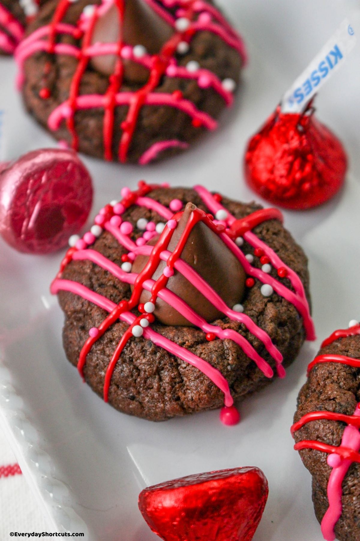 chocolate blossom cookies with candy melts drizzle and sprinkles