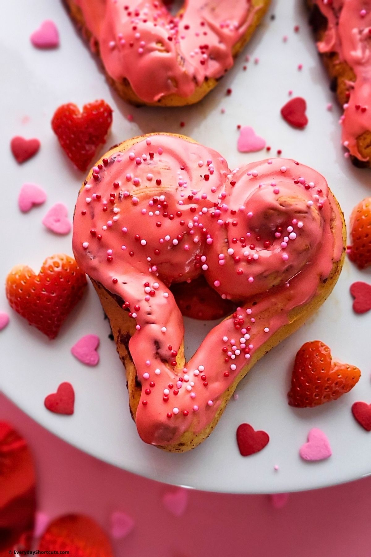 heart shaped cinnamon rolls with pink icing