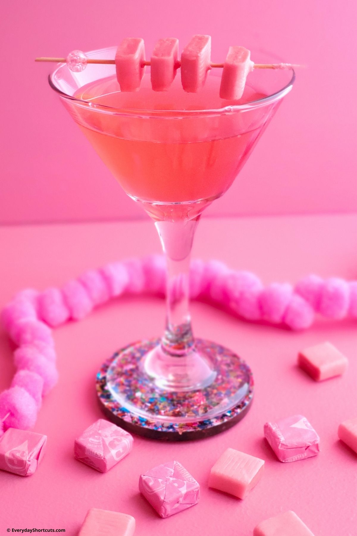 Starburst martini with pink starburst candy garnish