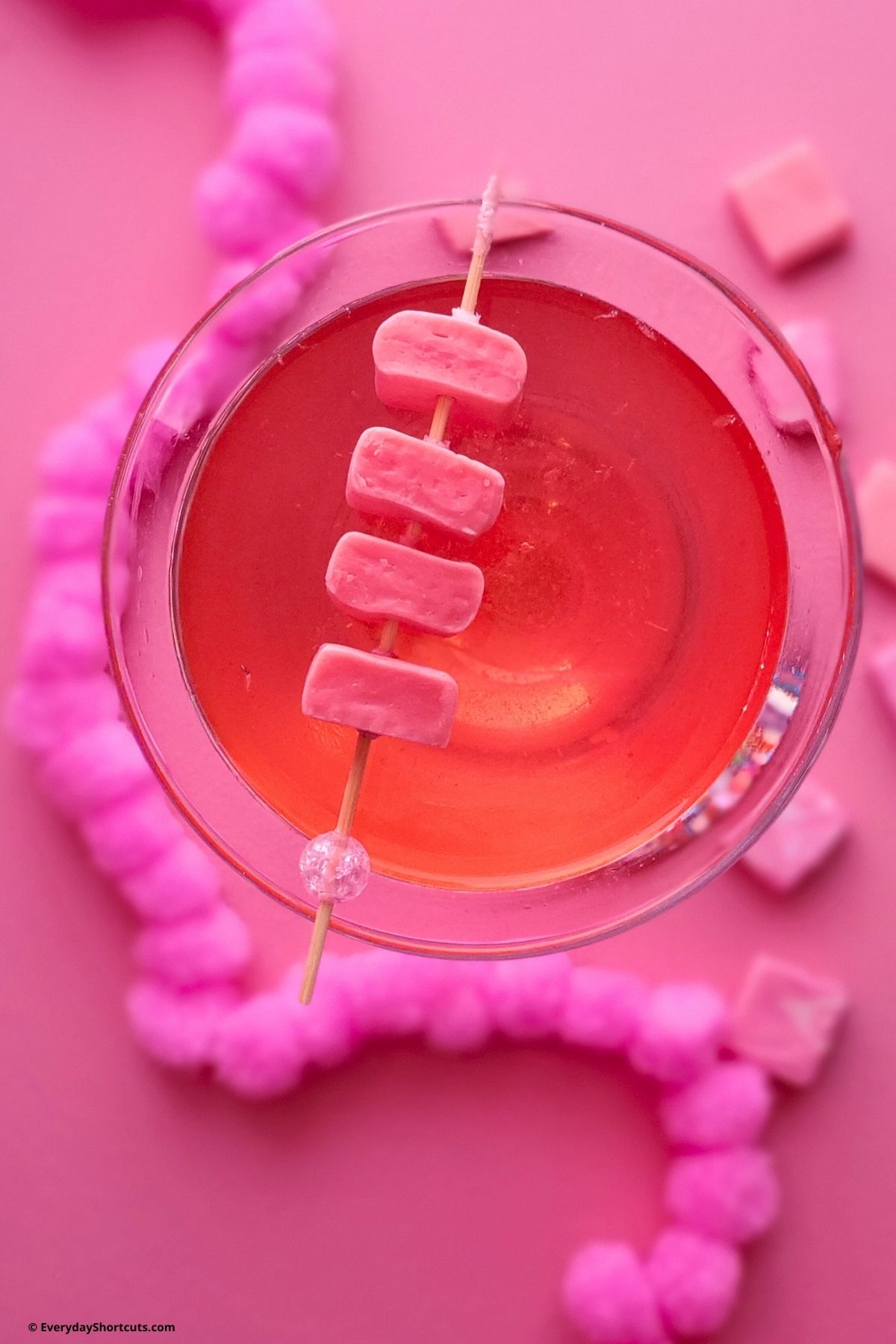 pink cocktail with pink candy