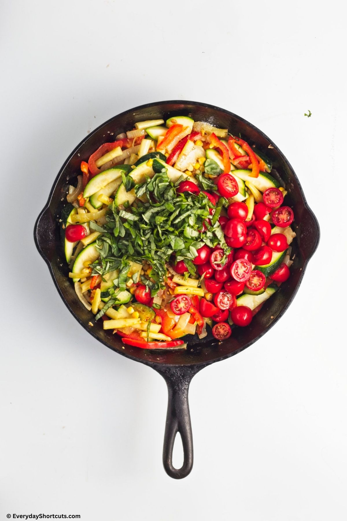 sauteing vegetables in a pan