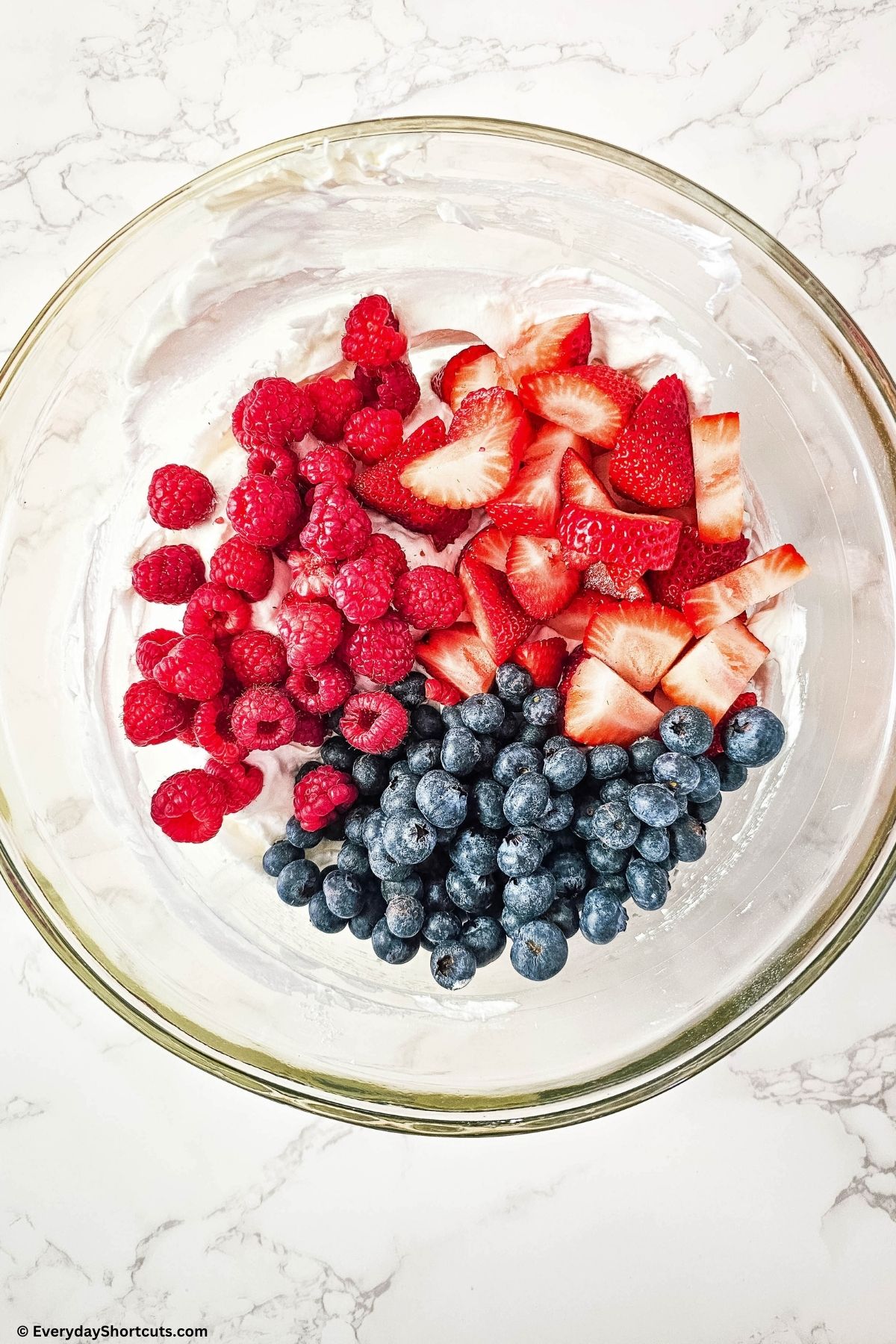fresh berries in a bowl with cheesecake filling
