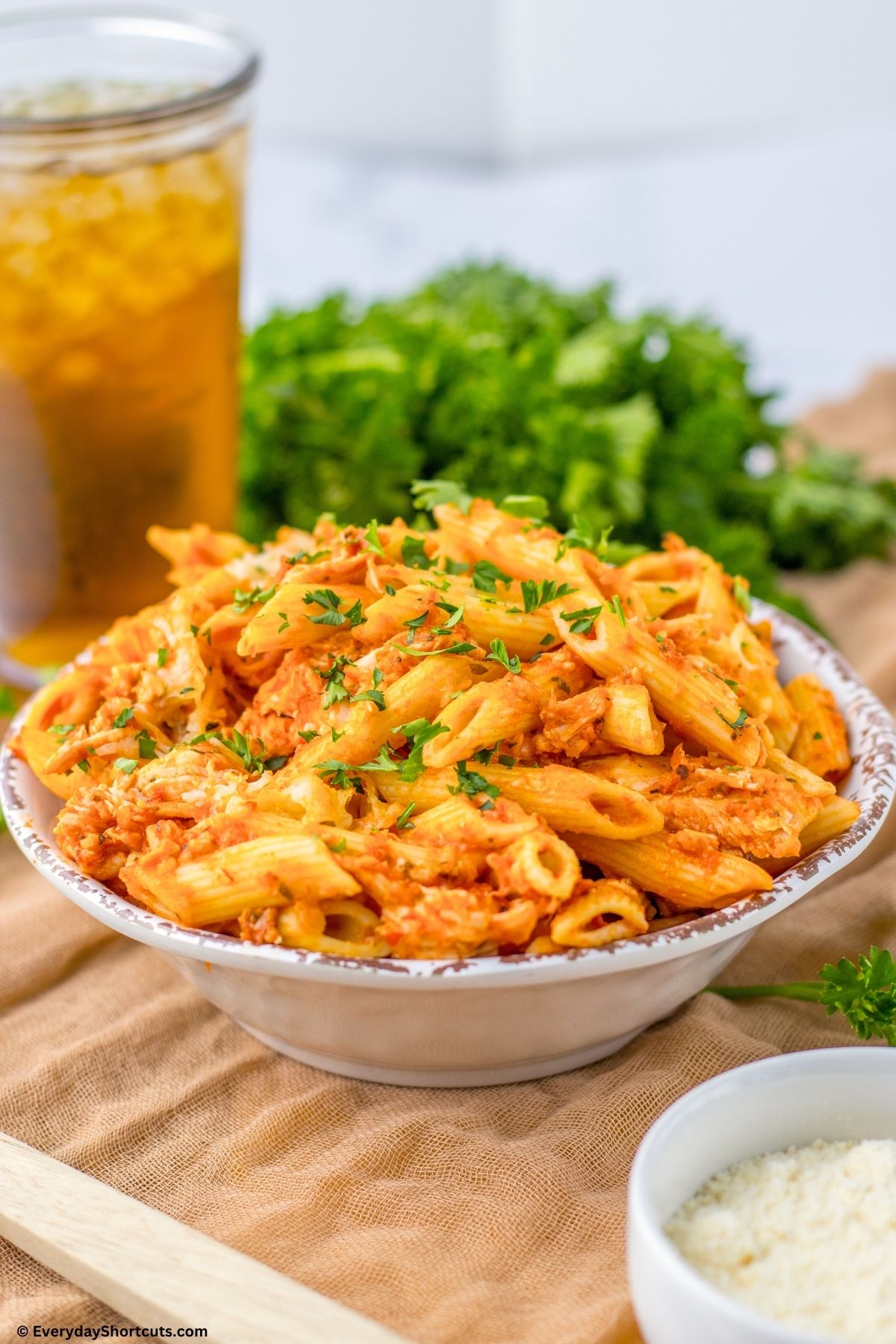 penne pasta chicken and cheese in a bowl