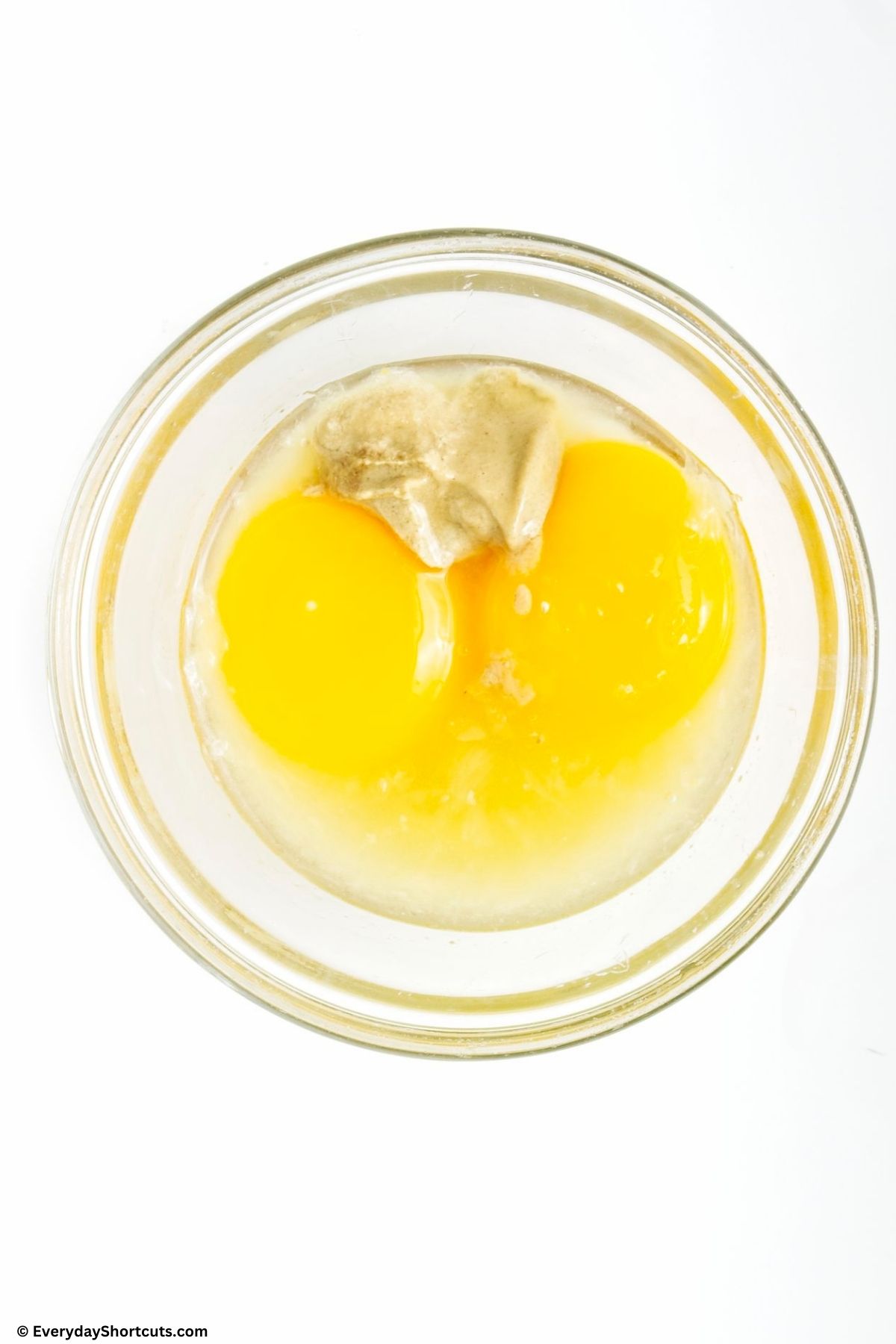 eggs and garlic in a measuring cup