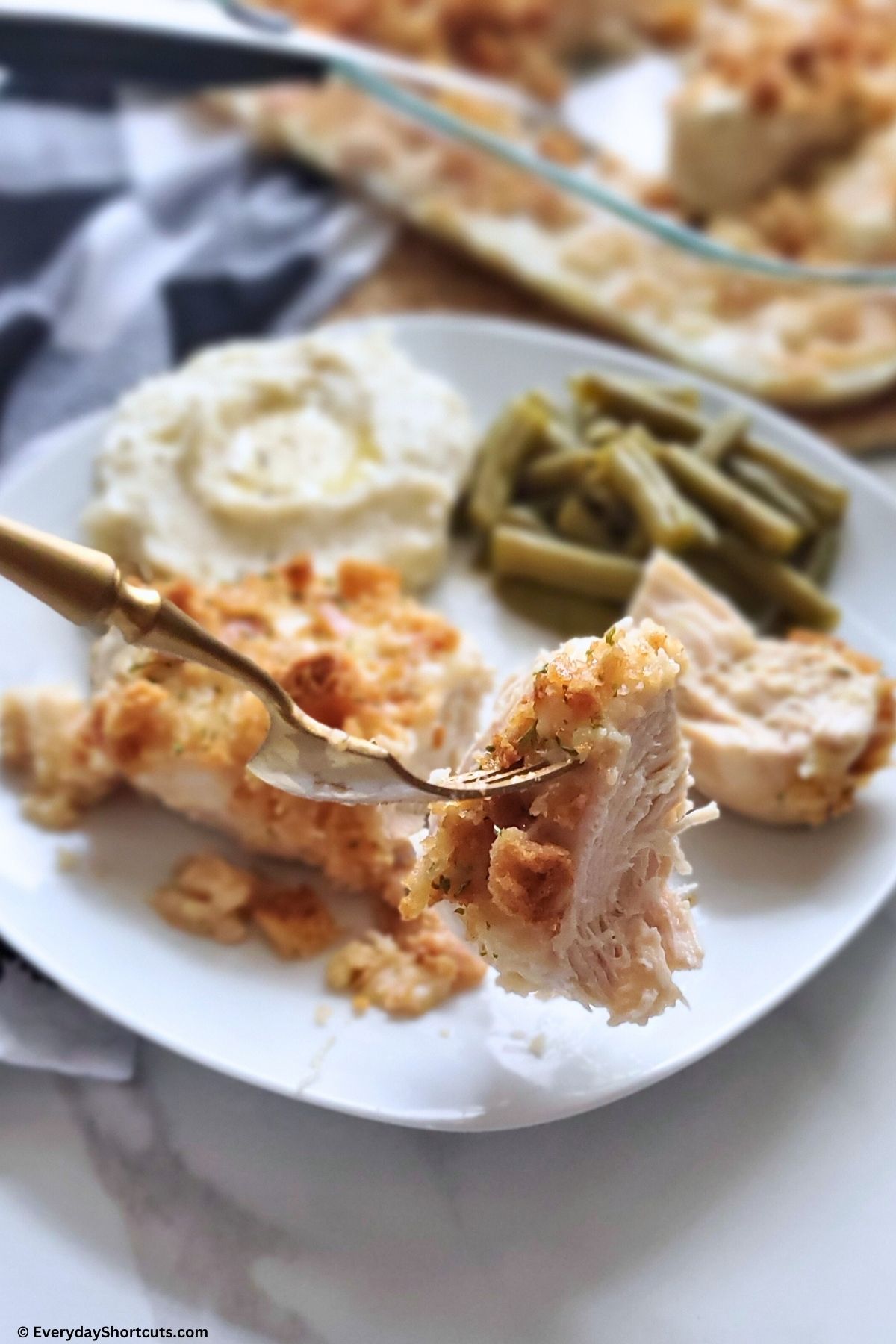 cut piece of swiss chicken on a fork