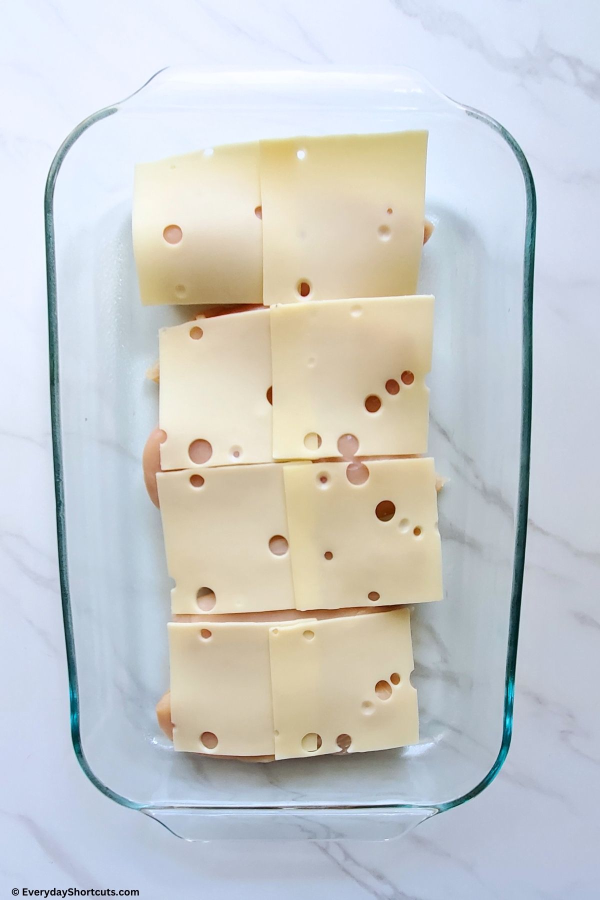 swiss cheese on top of chicken