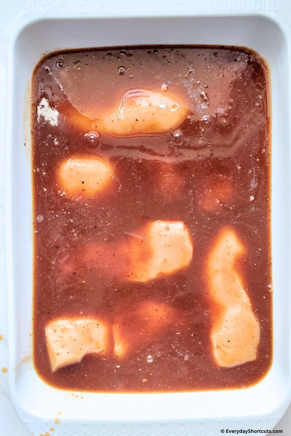 barbeque sauce with chicken in a pan