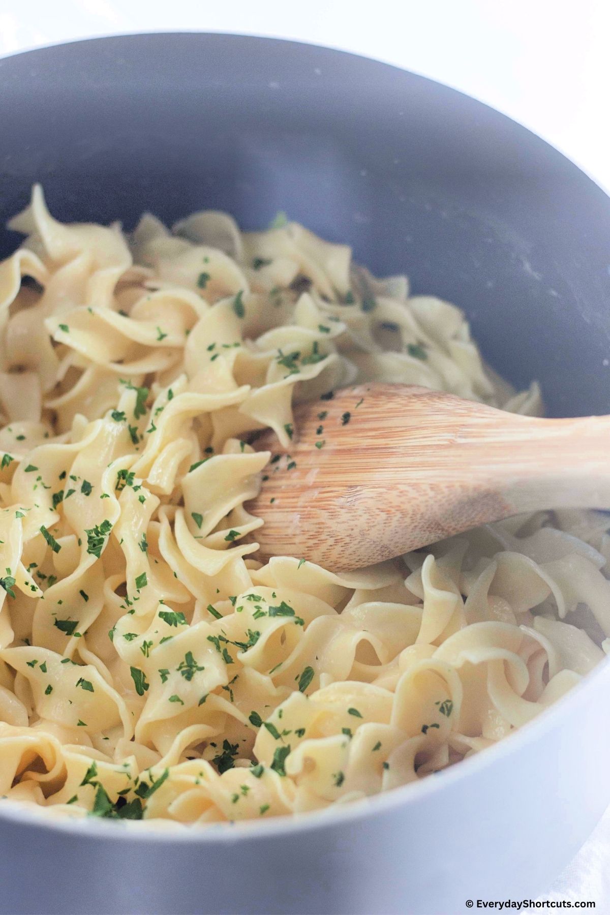 egg noodles with butter in a pan