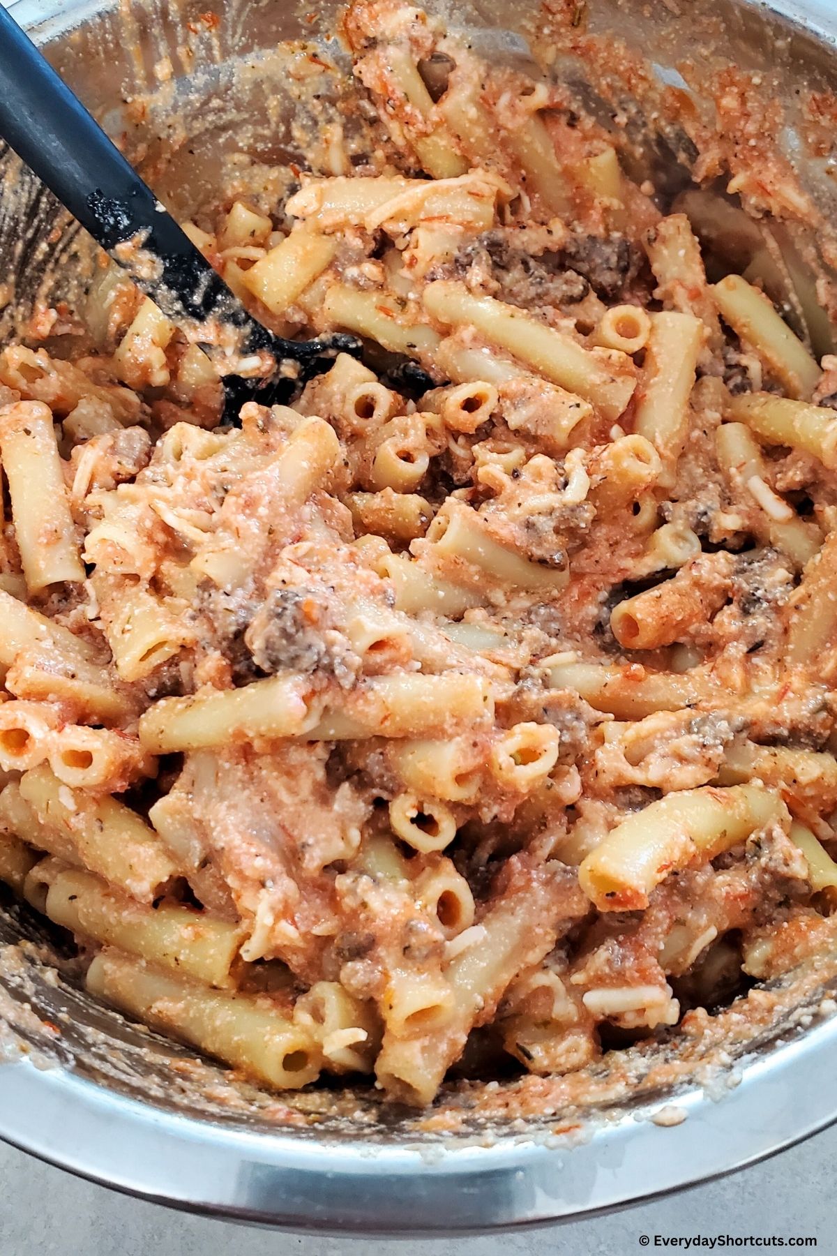 ziti ingredients mixed together in bowl