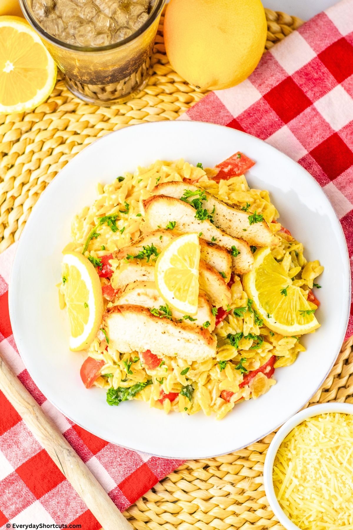 chicken with lemon and orzo on a plate
