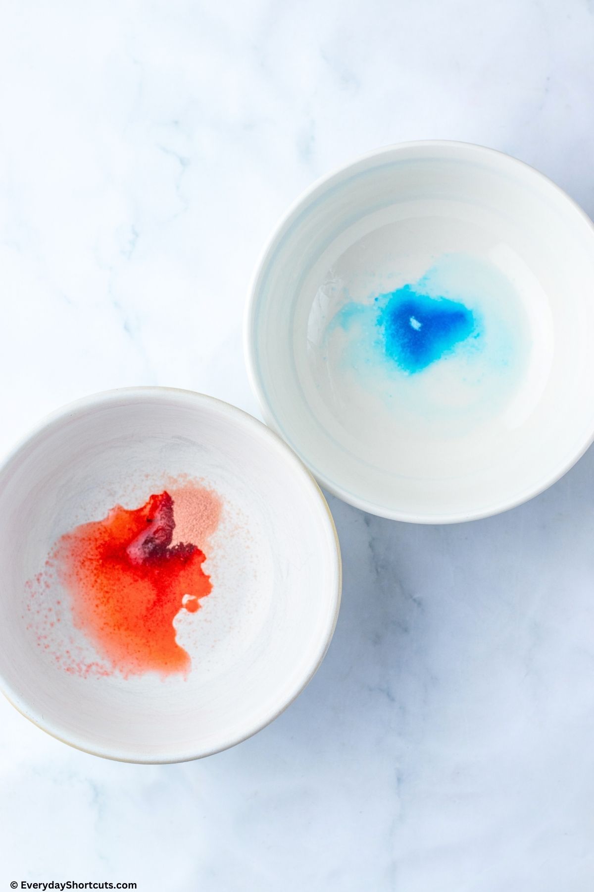 blue and red Jello powder mixture in separate bowls