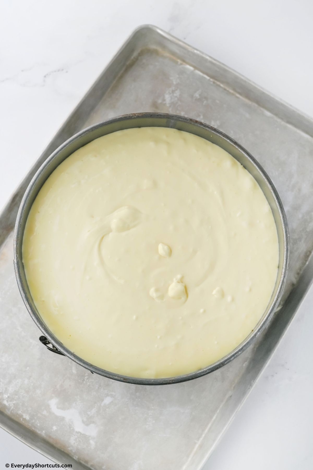 cheesecake filling poured in a springform pan