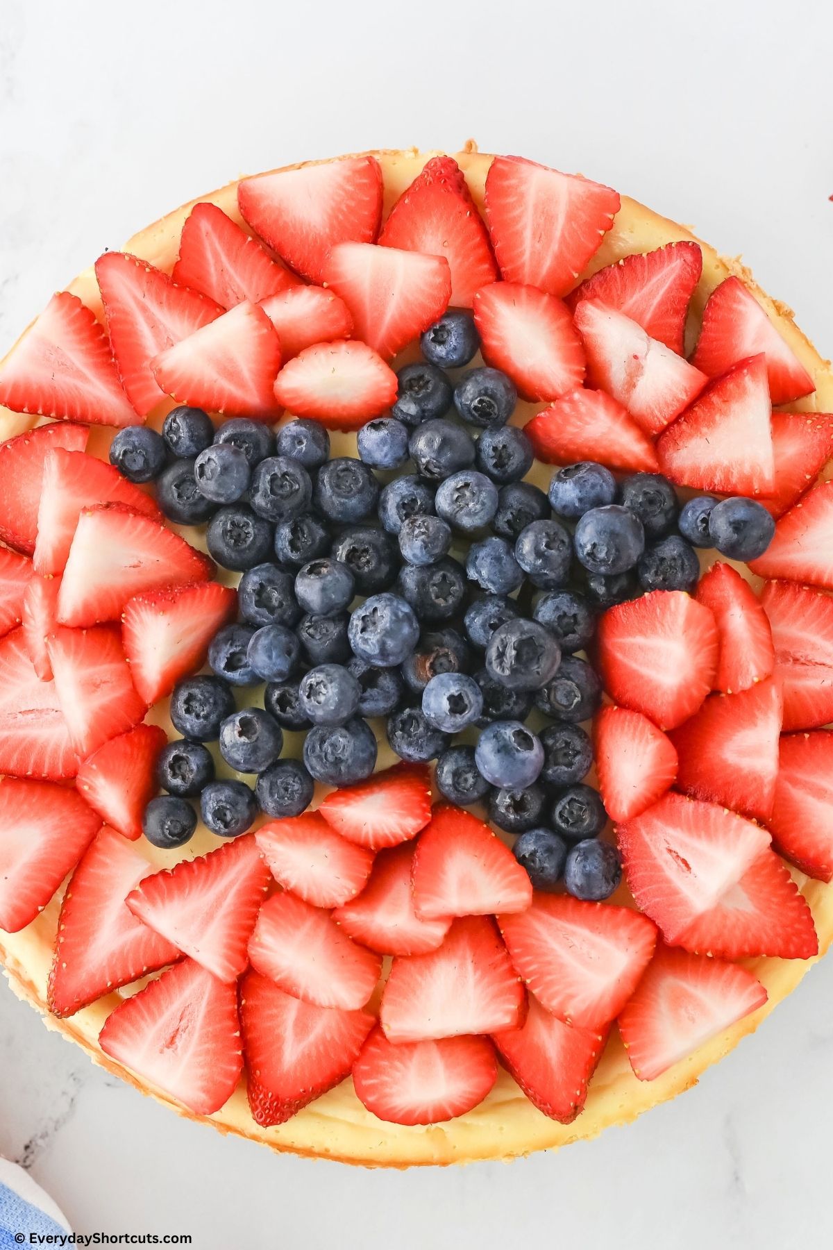decorated 4th of July cheesecake with blueberry star on top