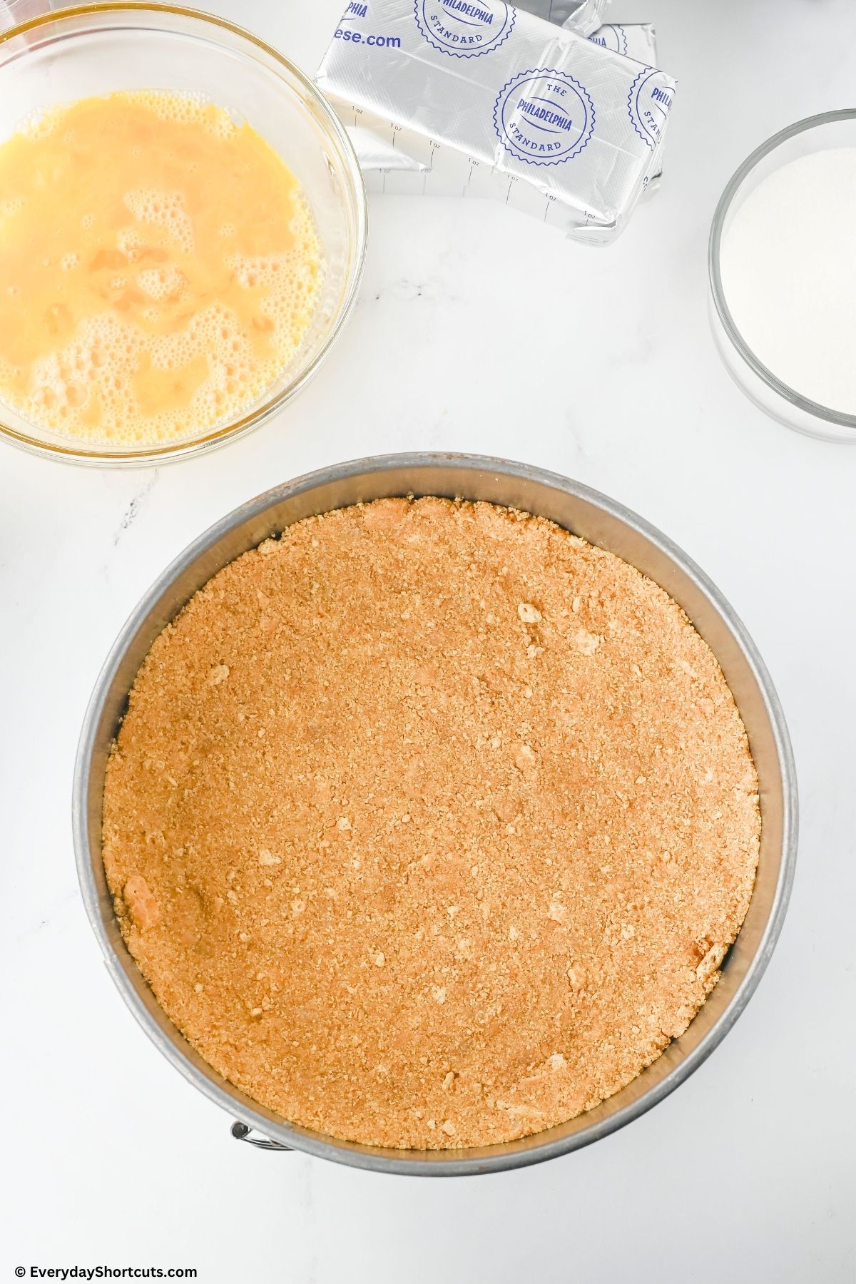 pressed graham cracker crust in springform pan
