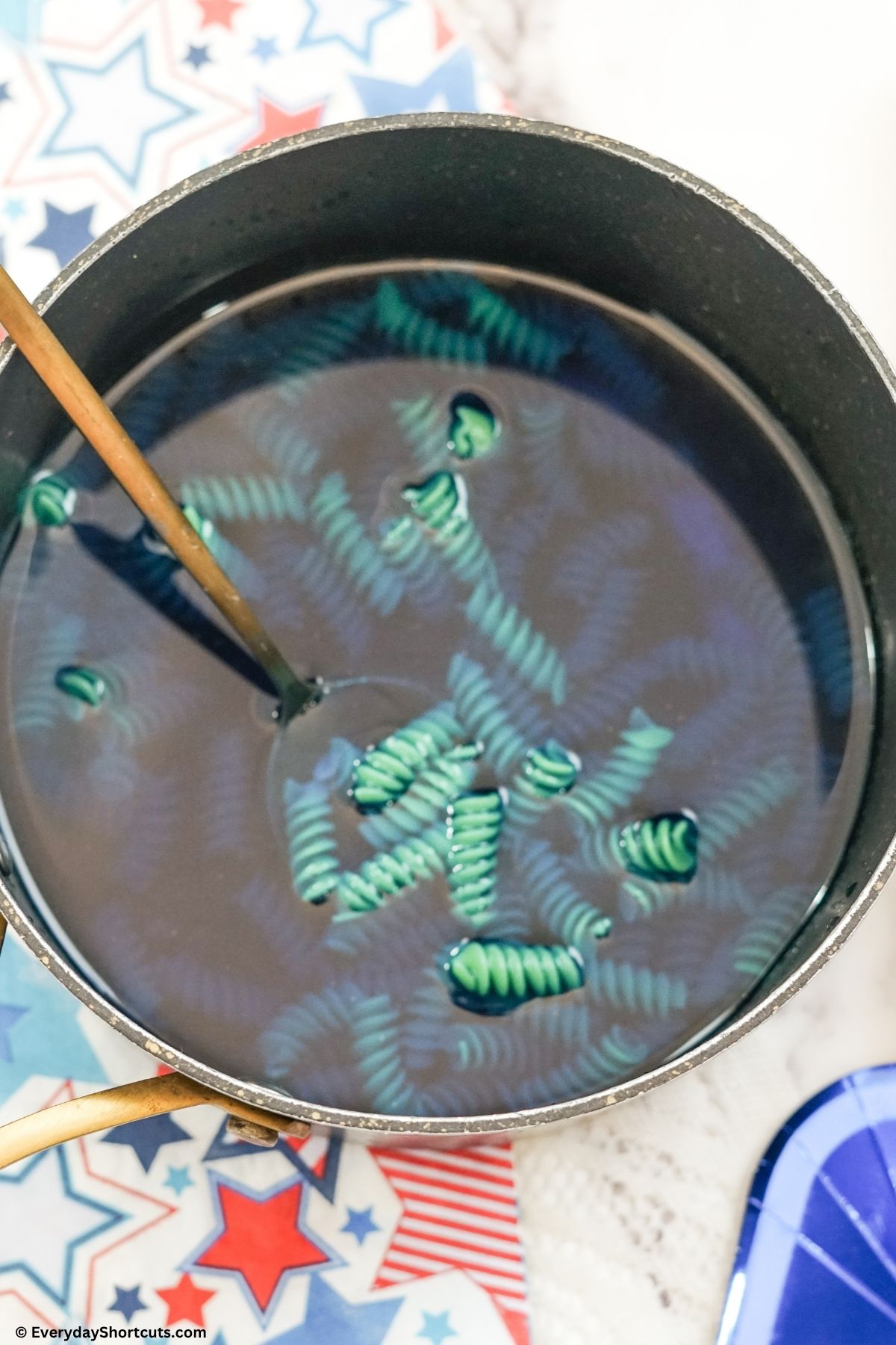 blue noodles in a pan