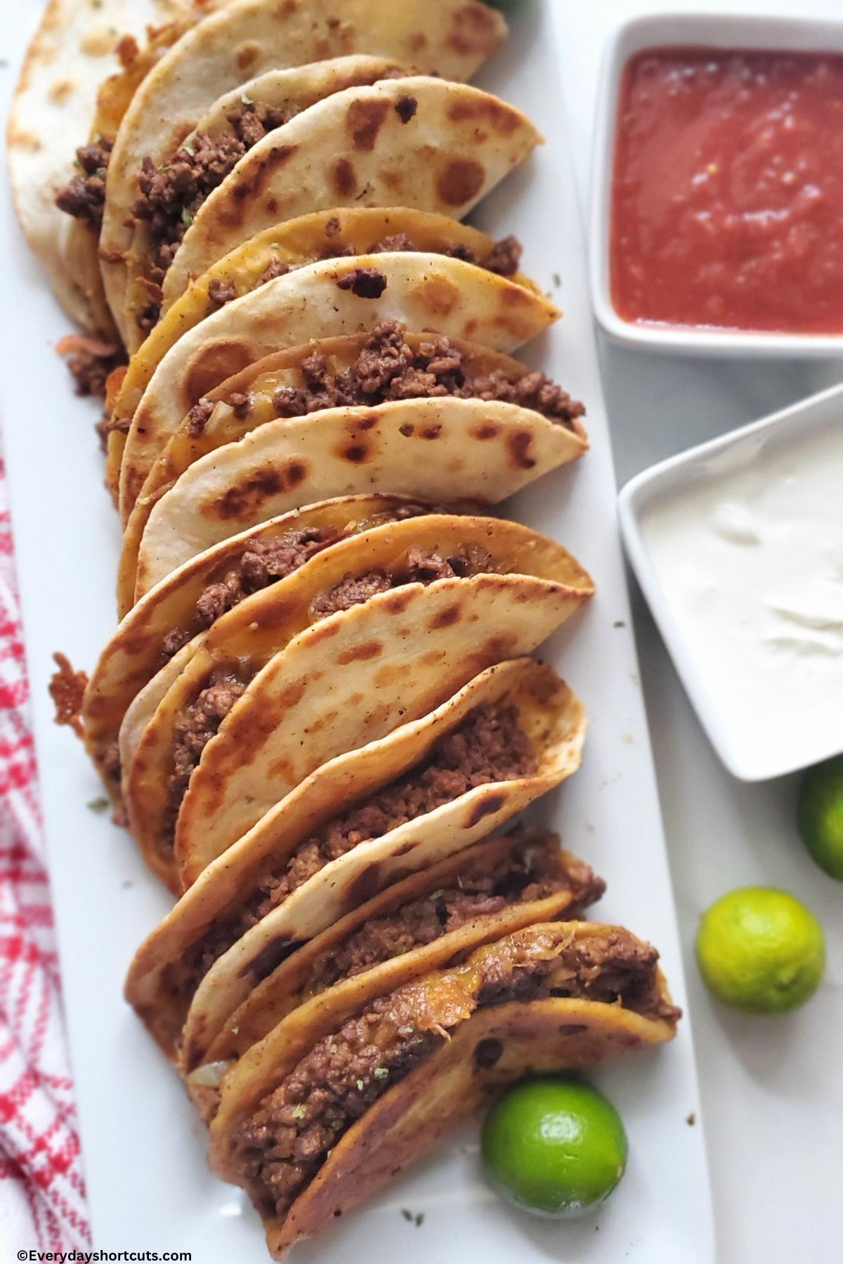 cheesy beef tacos on a plate