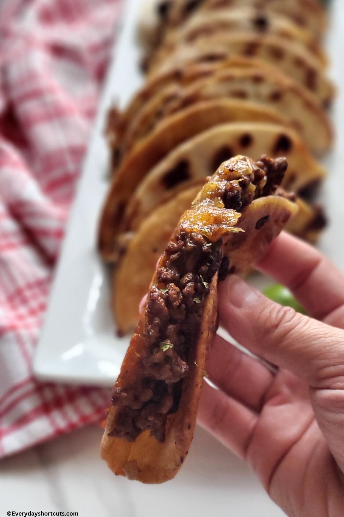 holding a mini beef taco