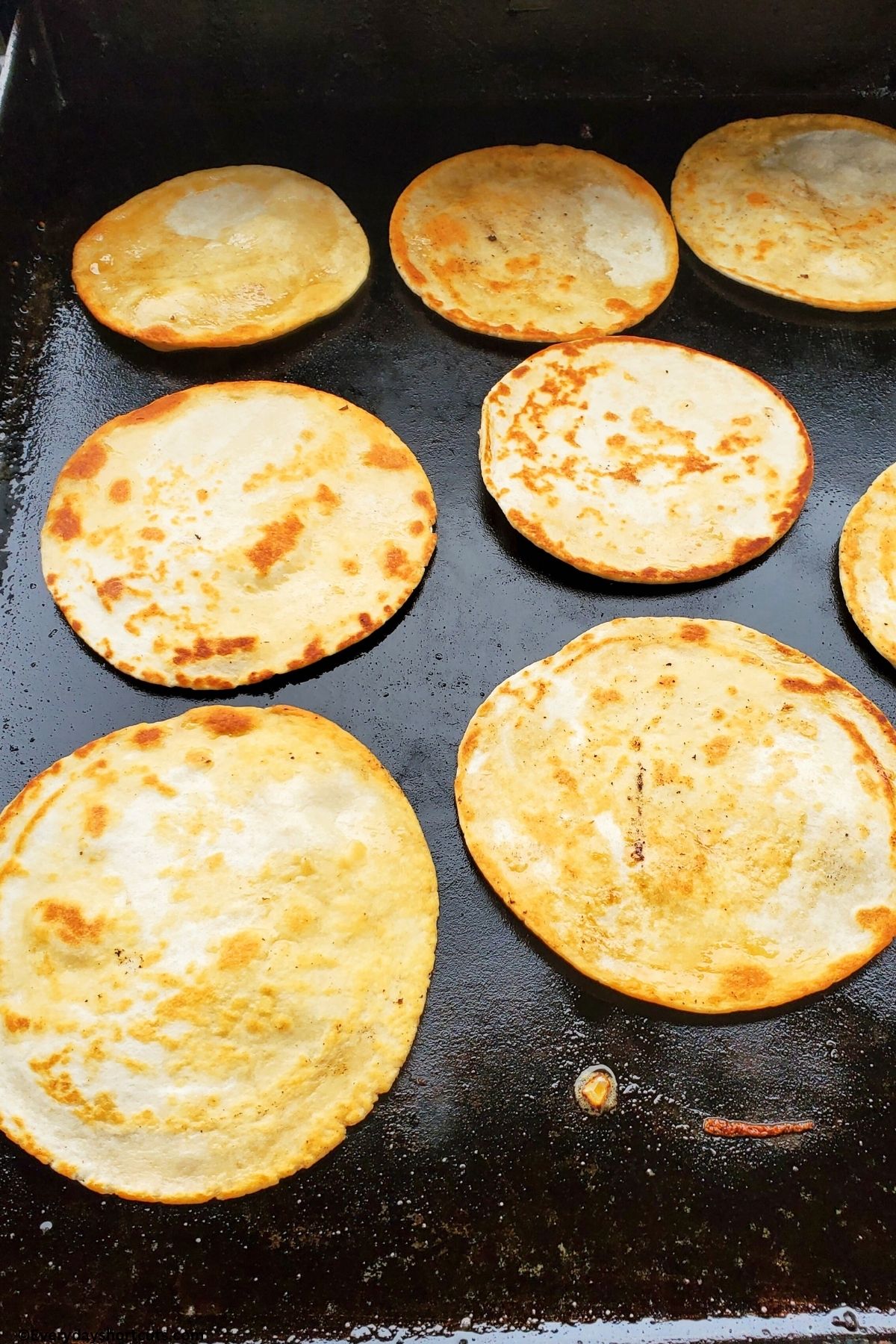 crispy flour tortillas on a griddle