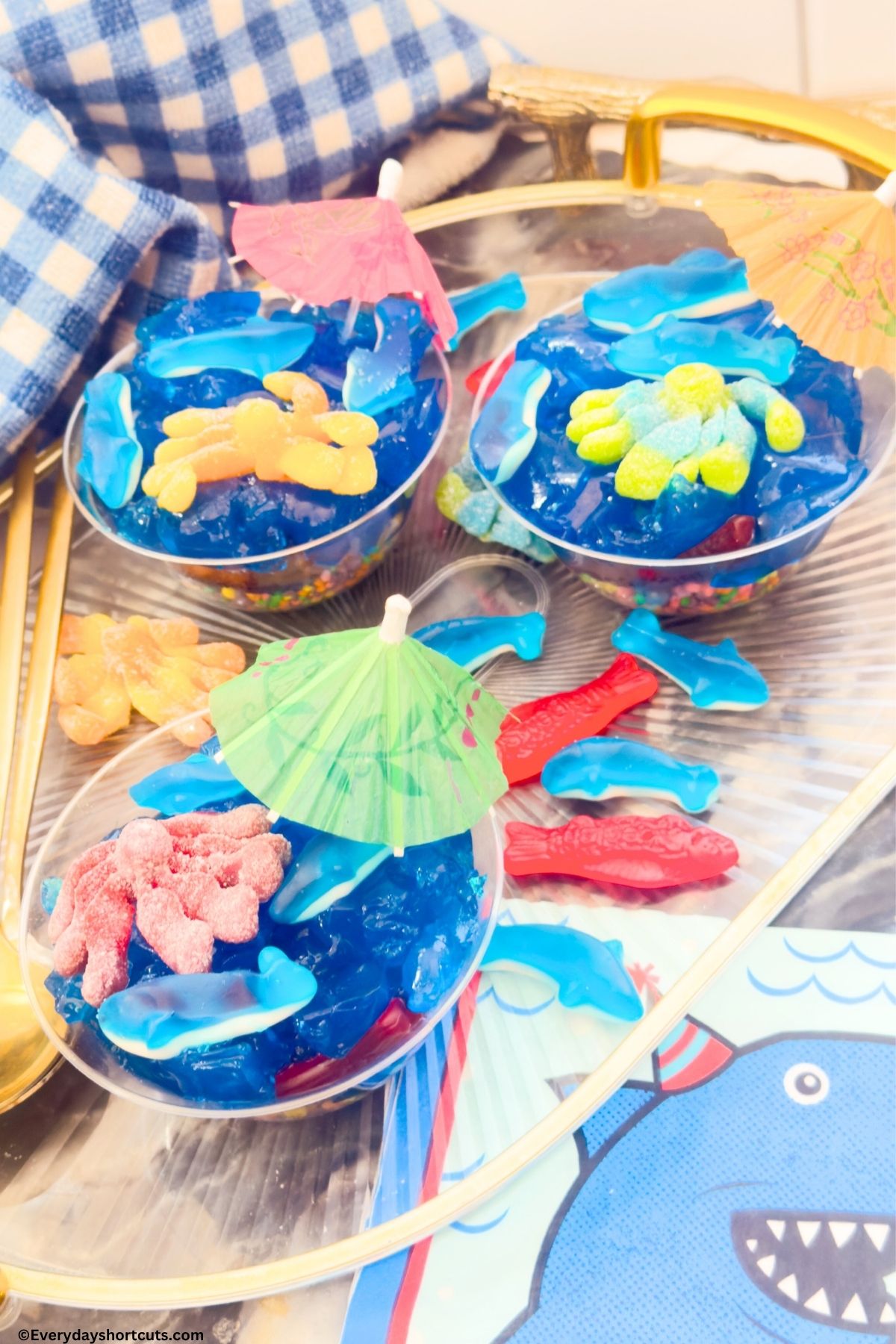 kids dessert cups with blue gelatin and gummy fish
