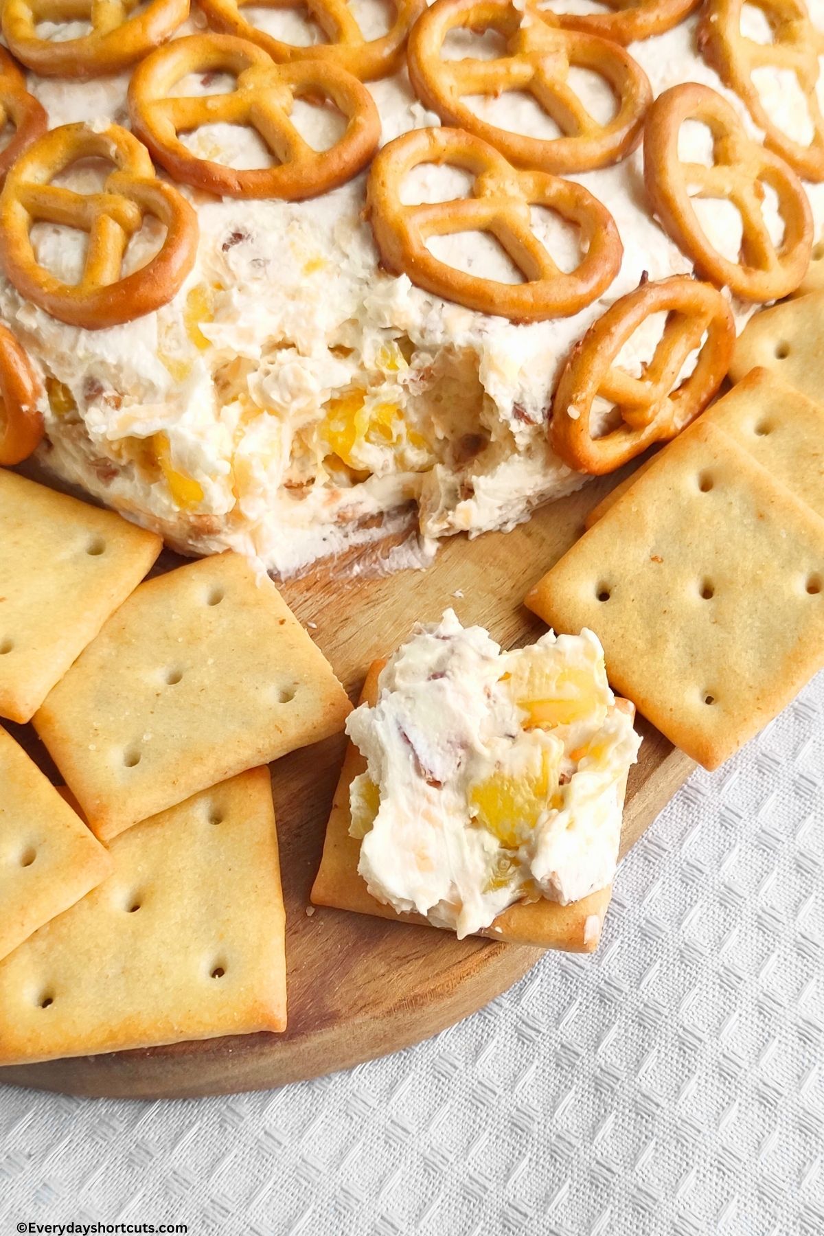 pineapple cheese ball on a cracker