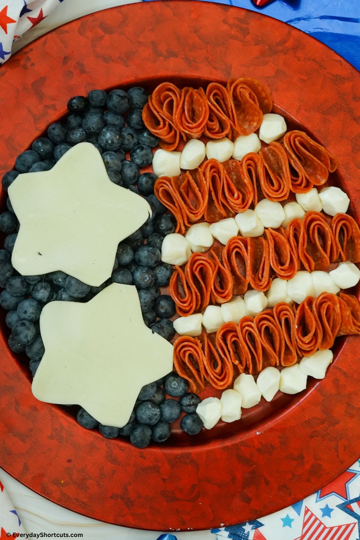 meat and cheese in the shape of a flag charcuterie board