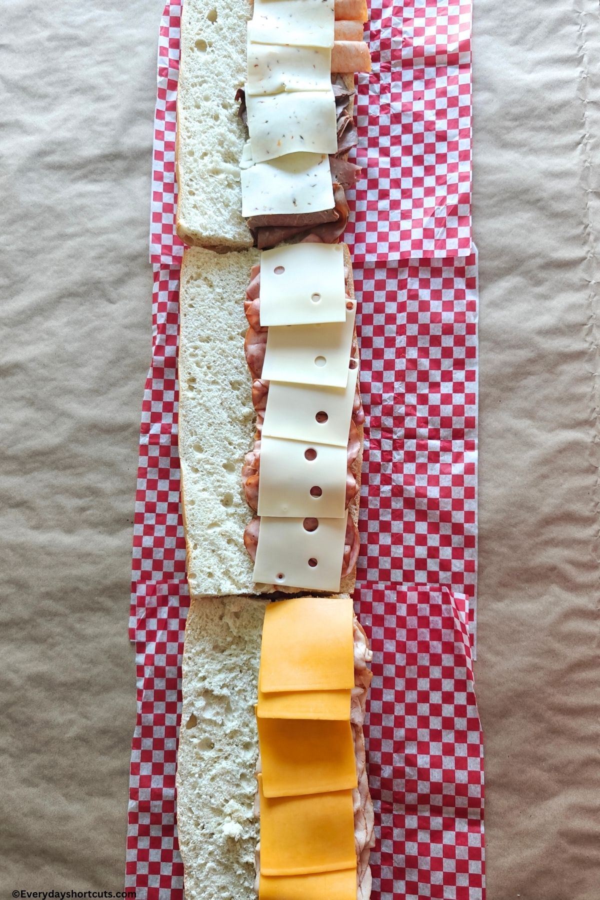 cheeses and lunch meats on Italian bread