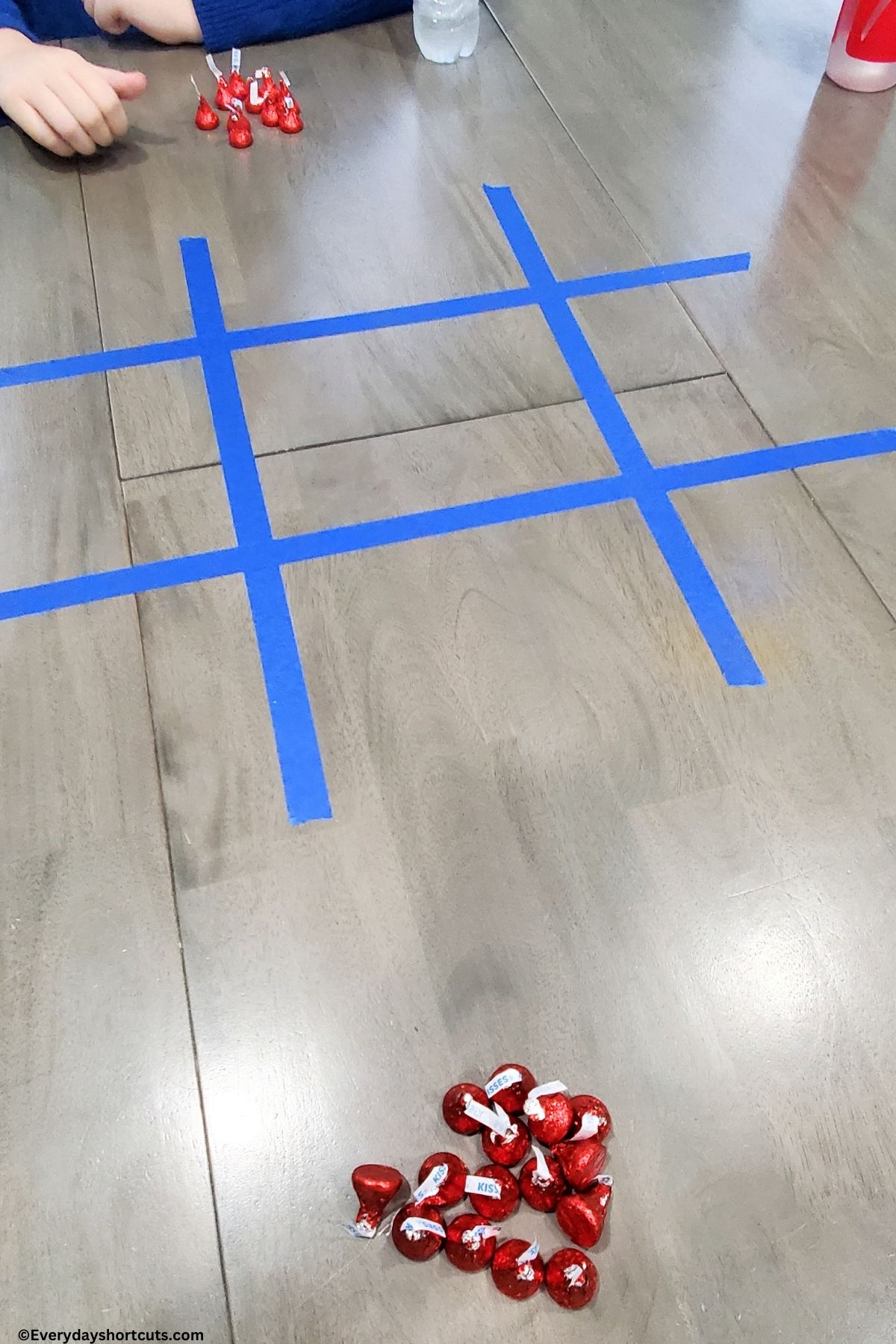 Hershey Kisses Tic Tac Toe with painters tape and Hershey Kisses