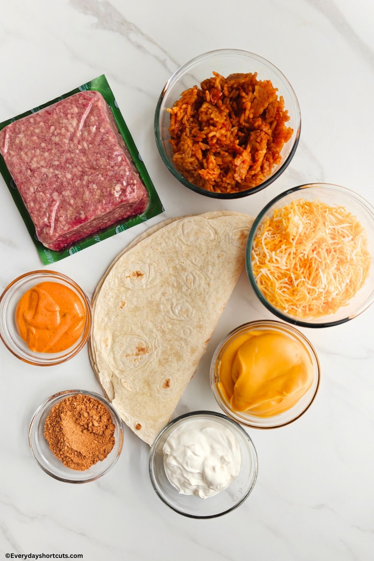 uncooked ground beef Spanish rice shredded cheese Chipotle sauce flour tortillas nacho cheese sauce taco seasoning and sour cream