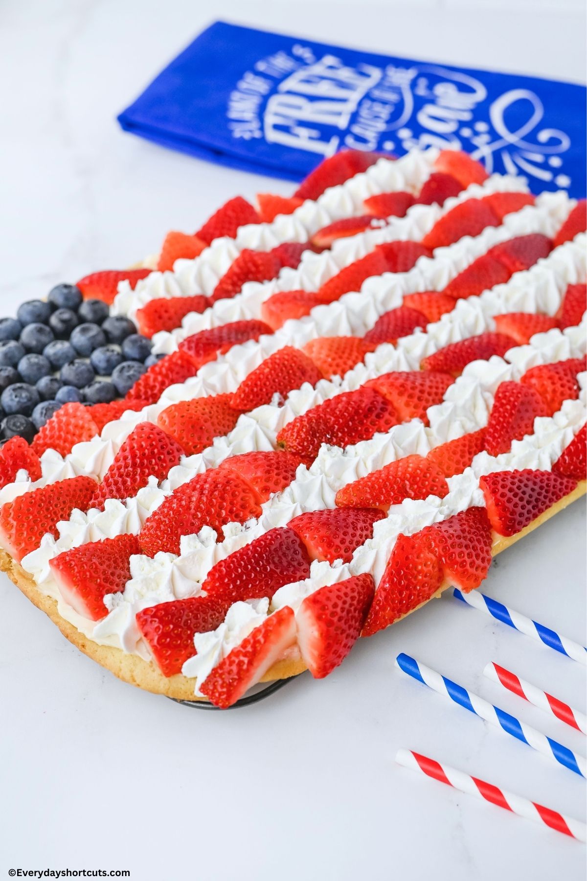 strawberries blueberries and cool whip in the design of a flag