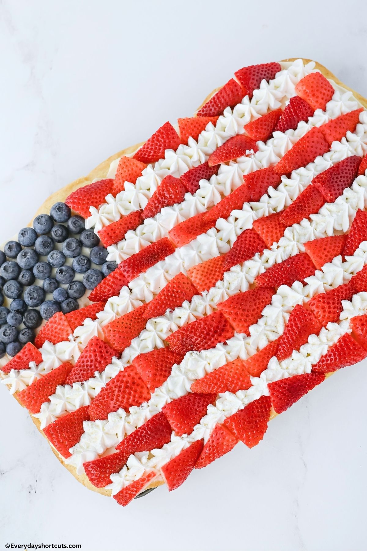 American Flag Fruit Cookie Pizza on a white board