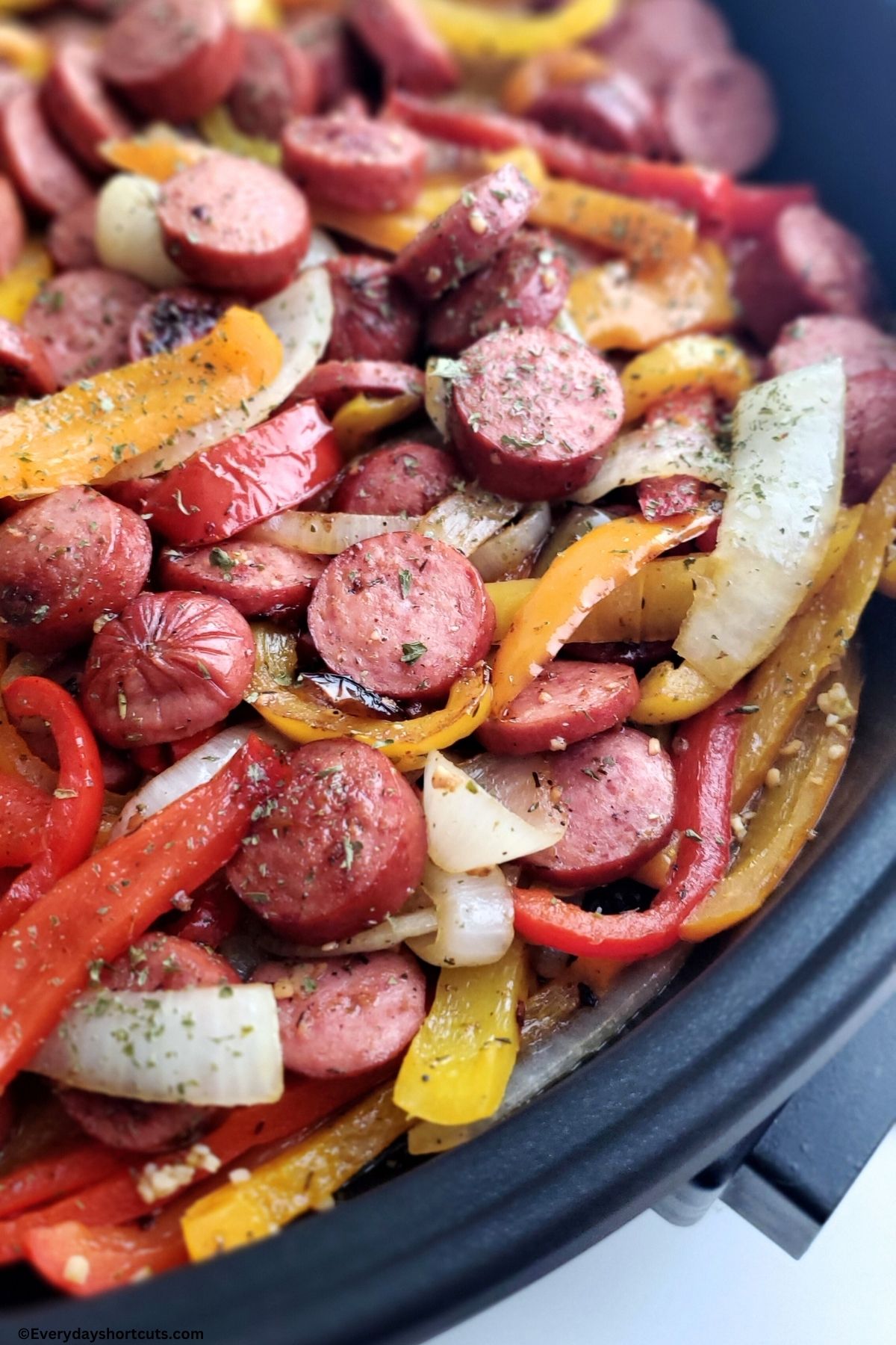 seasoned sausage bell peppers and sliced onions cooked