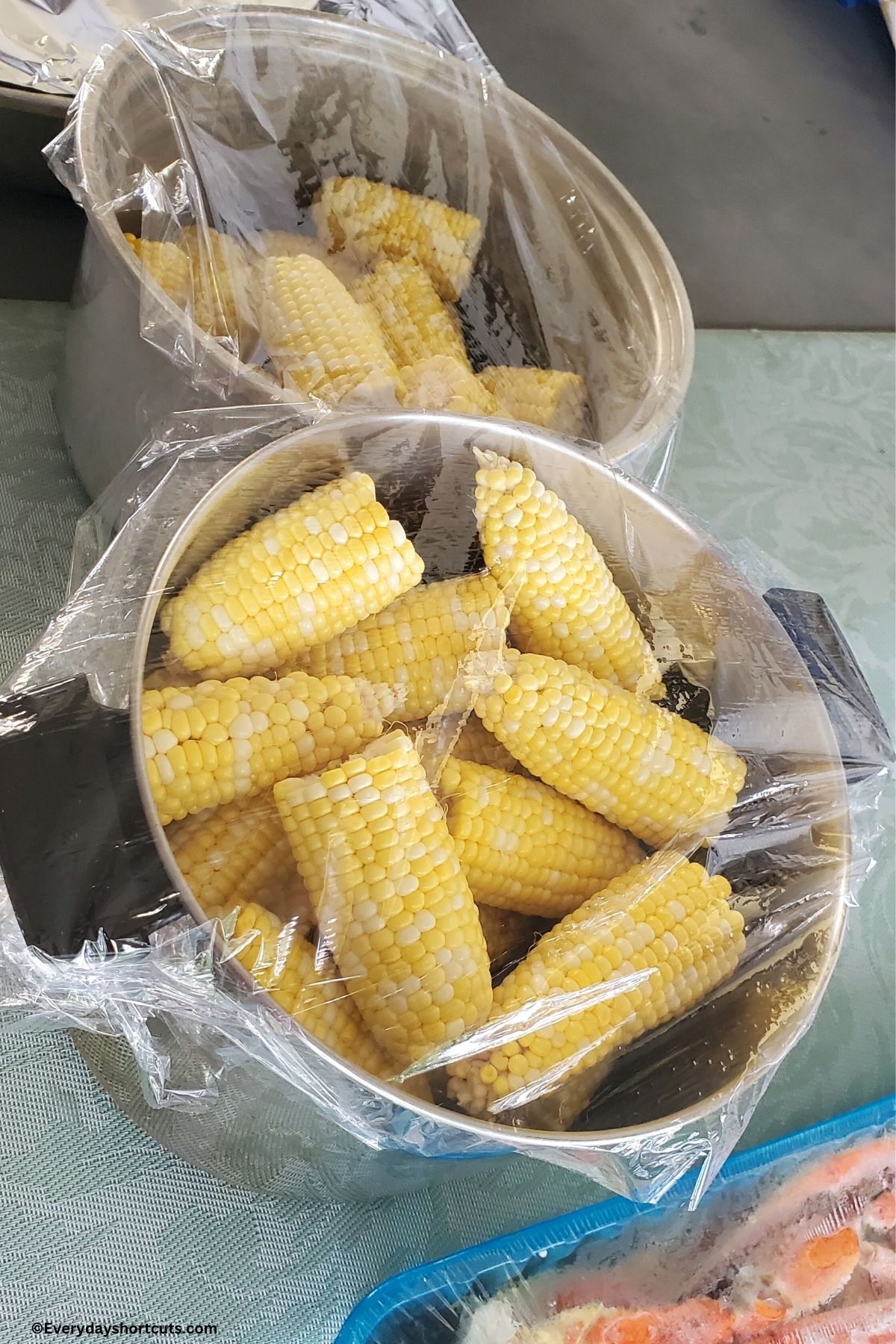 corn on the cob halves in stock pots