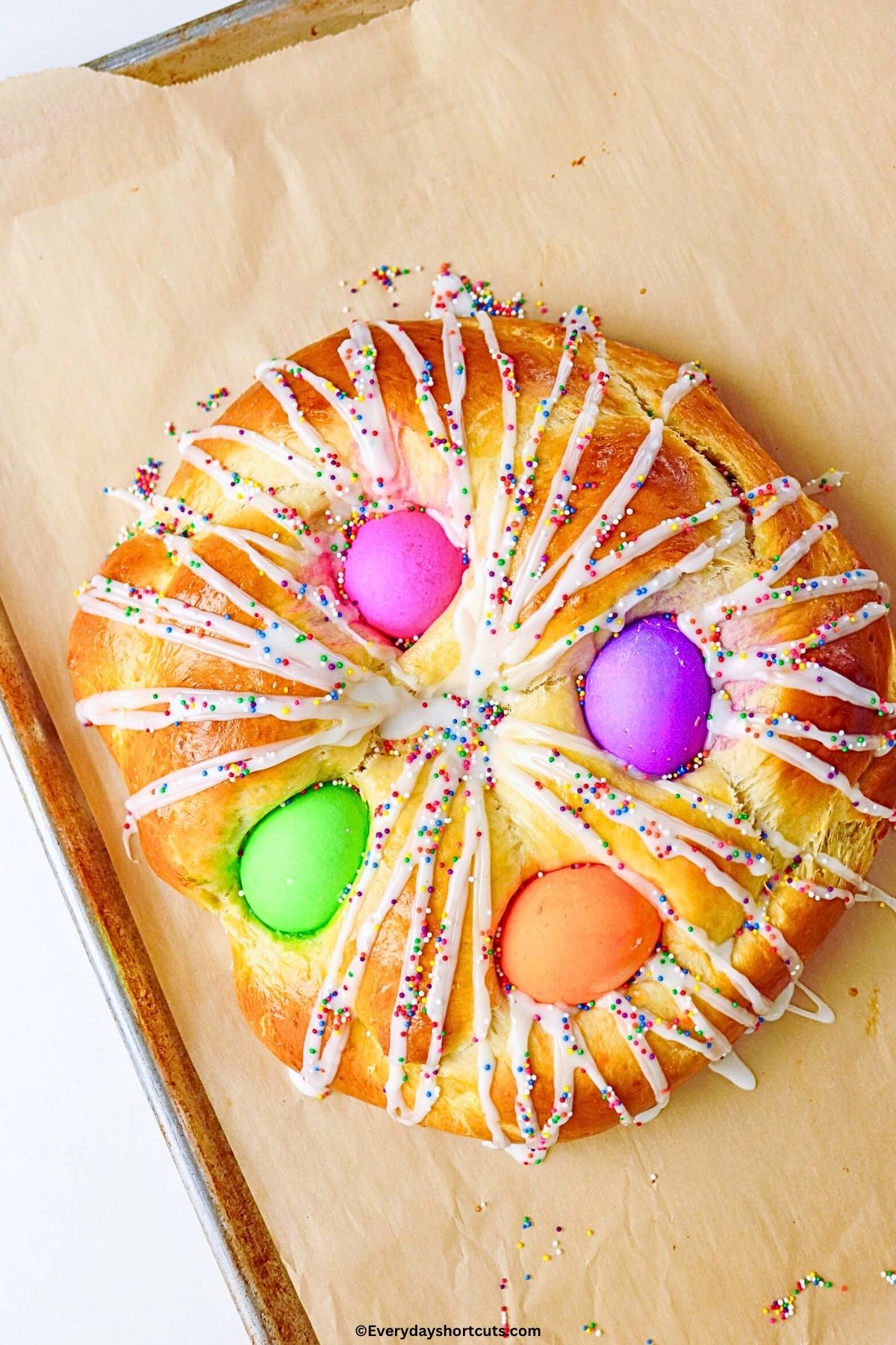 icing, sprinkles and colored eggs on top of rEaster bread