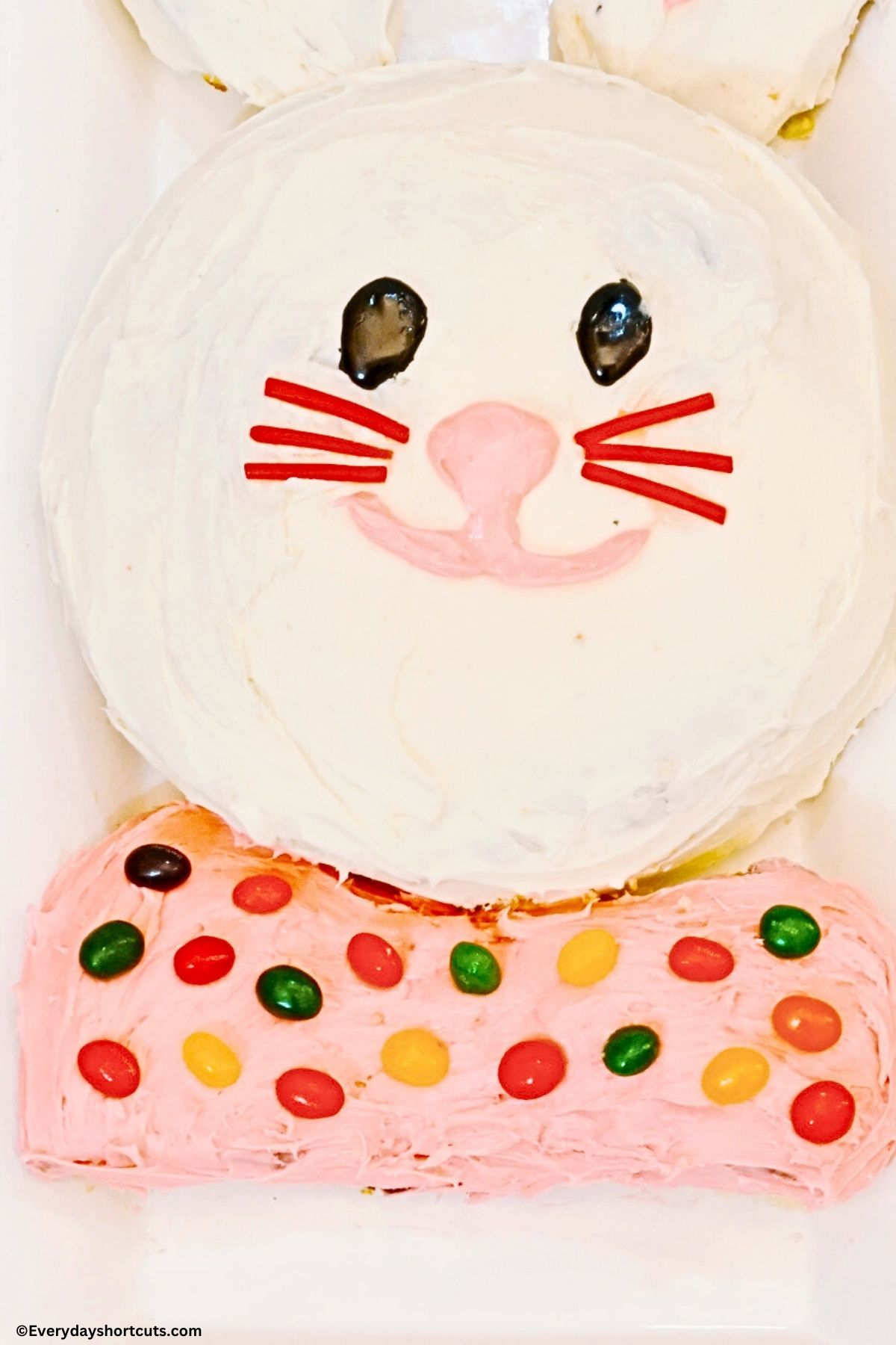 frost the bow tie with pink icing and decorate with jelly beans