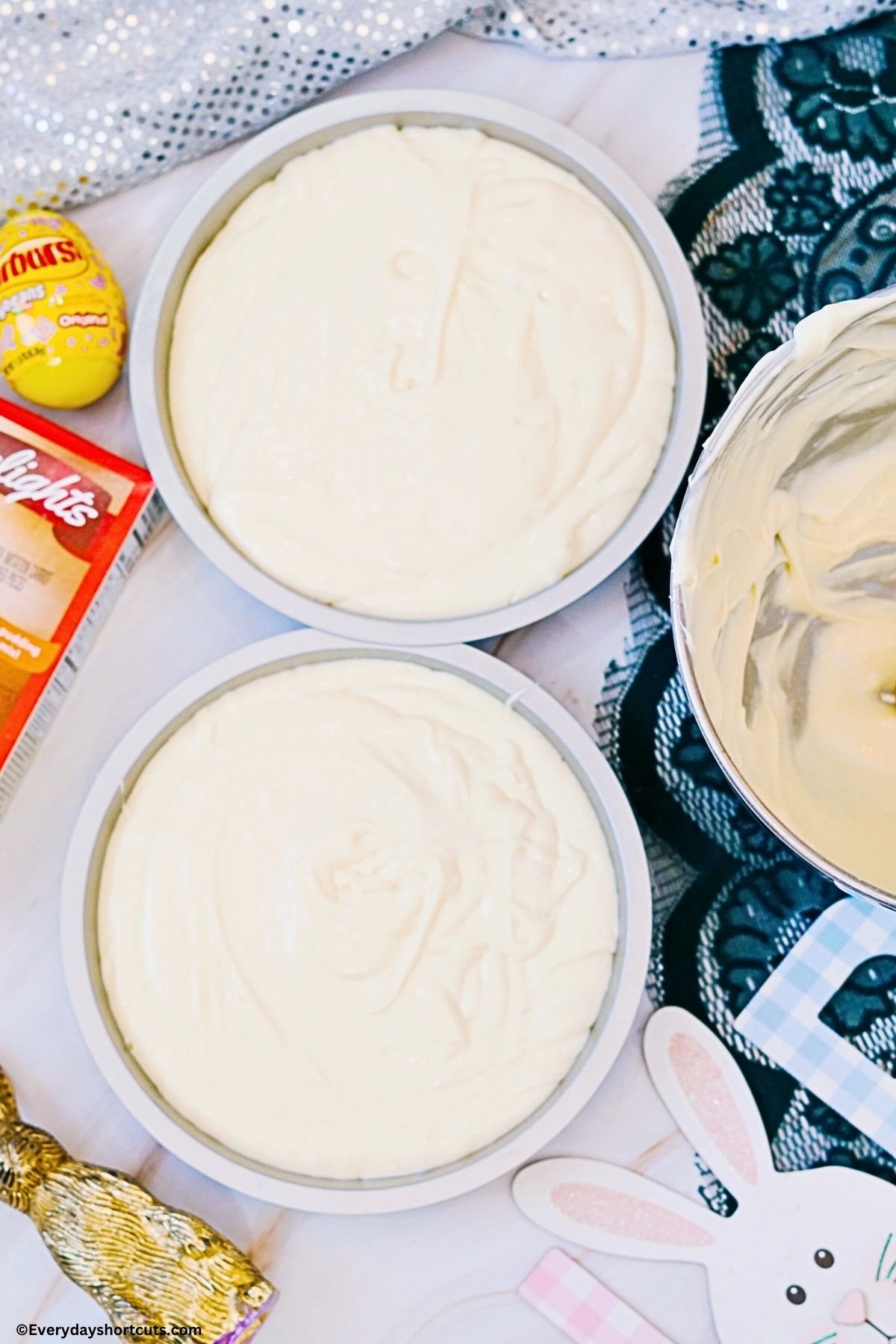 2 round cake pans filled with cake batter