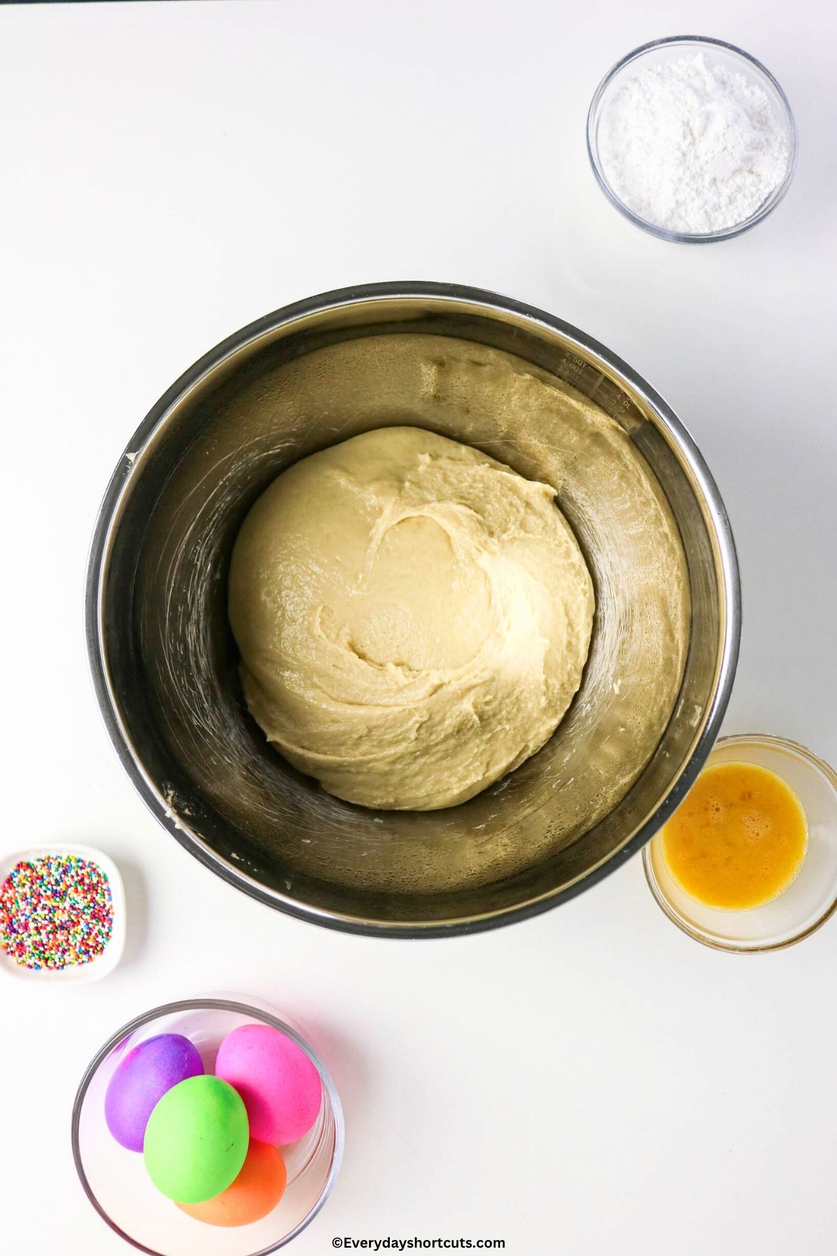 kneaded bread dough in a ball in a kitchen aid mixer bowl
