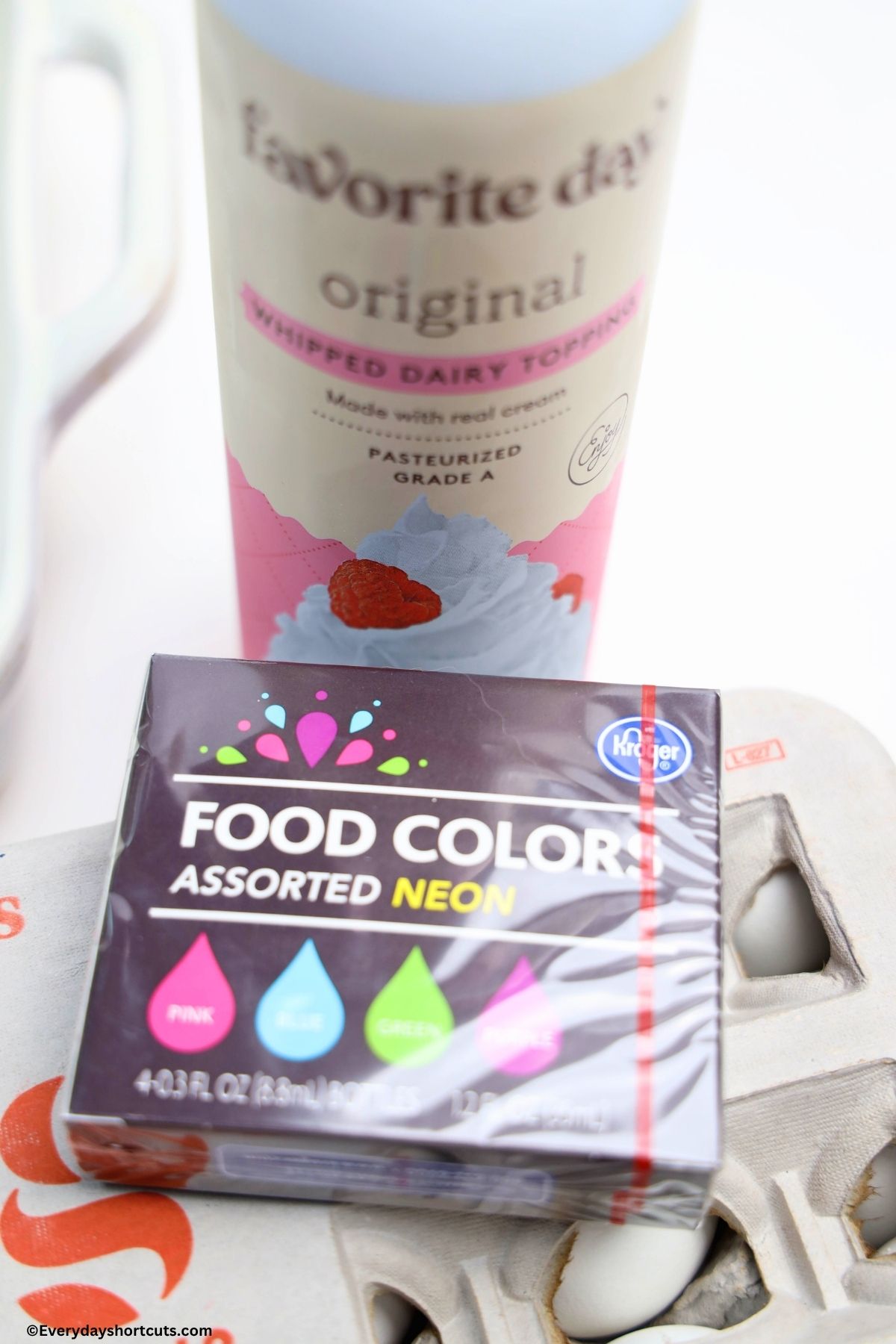 Ingredients shown: whipped cream, food coloring and eggs