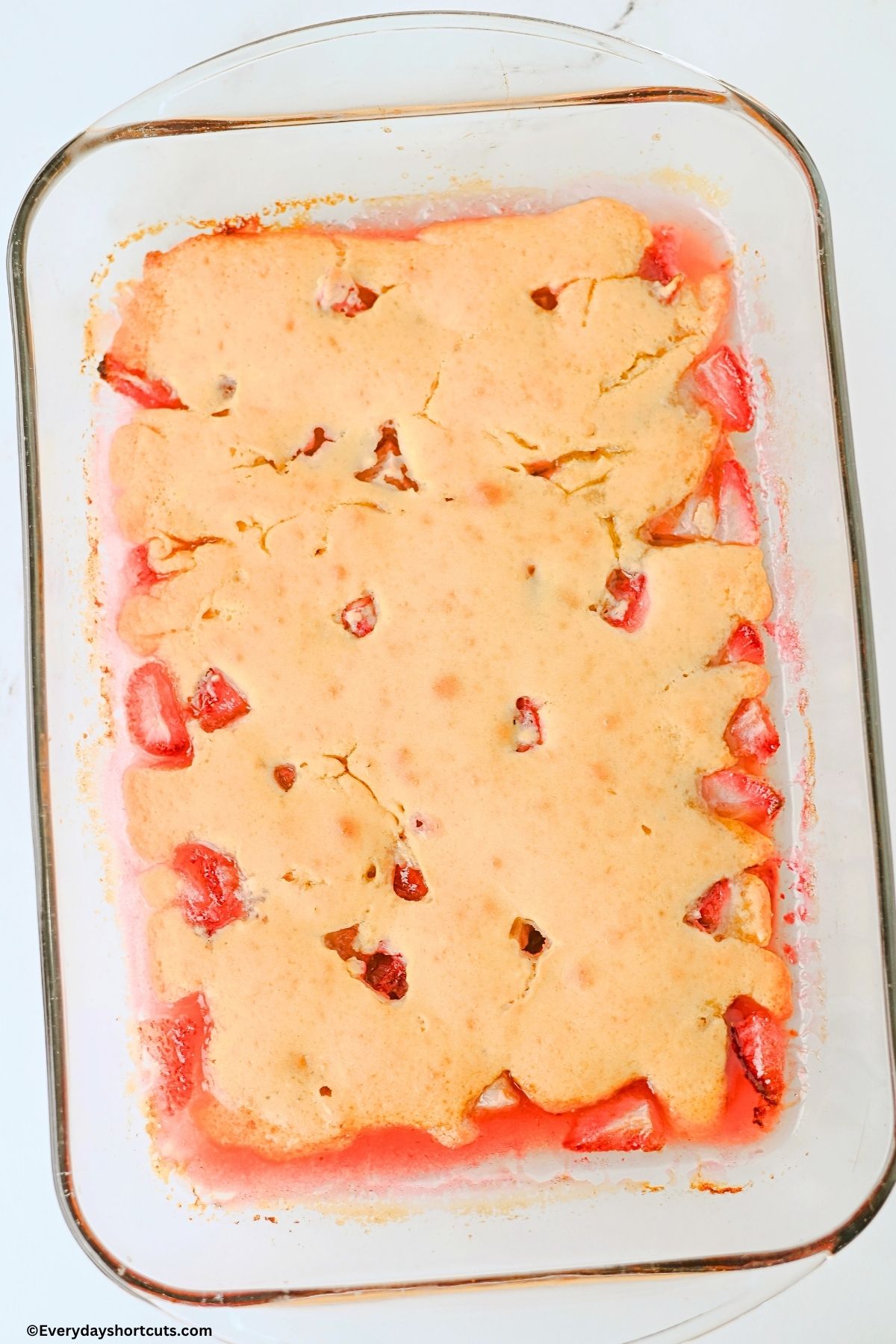 baked strawberry cobbler in a baking dish