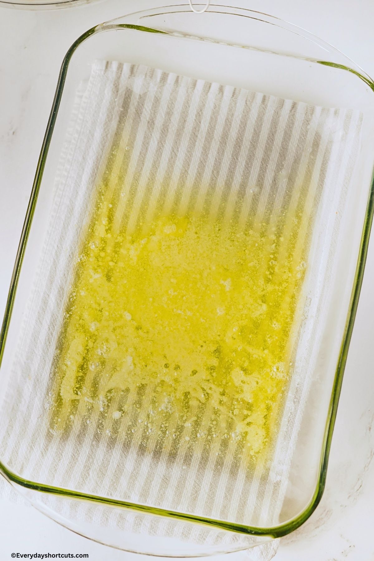 melted butter in a baking dish