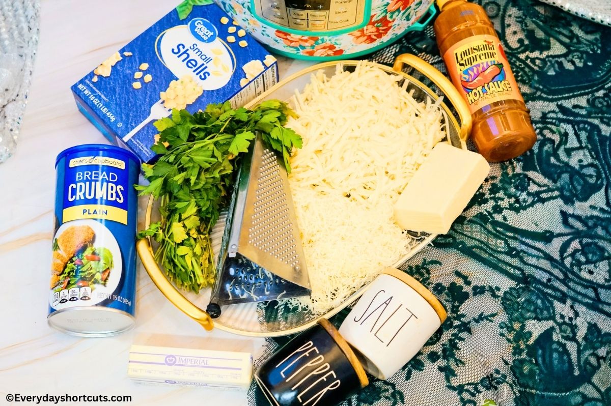 ingredients shown: pasta shells, bread crumbs, hot sauce, white cheddar and white American cheddar cheese