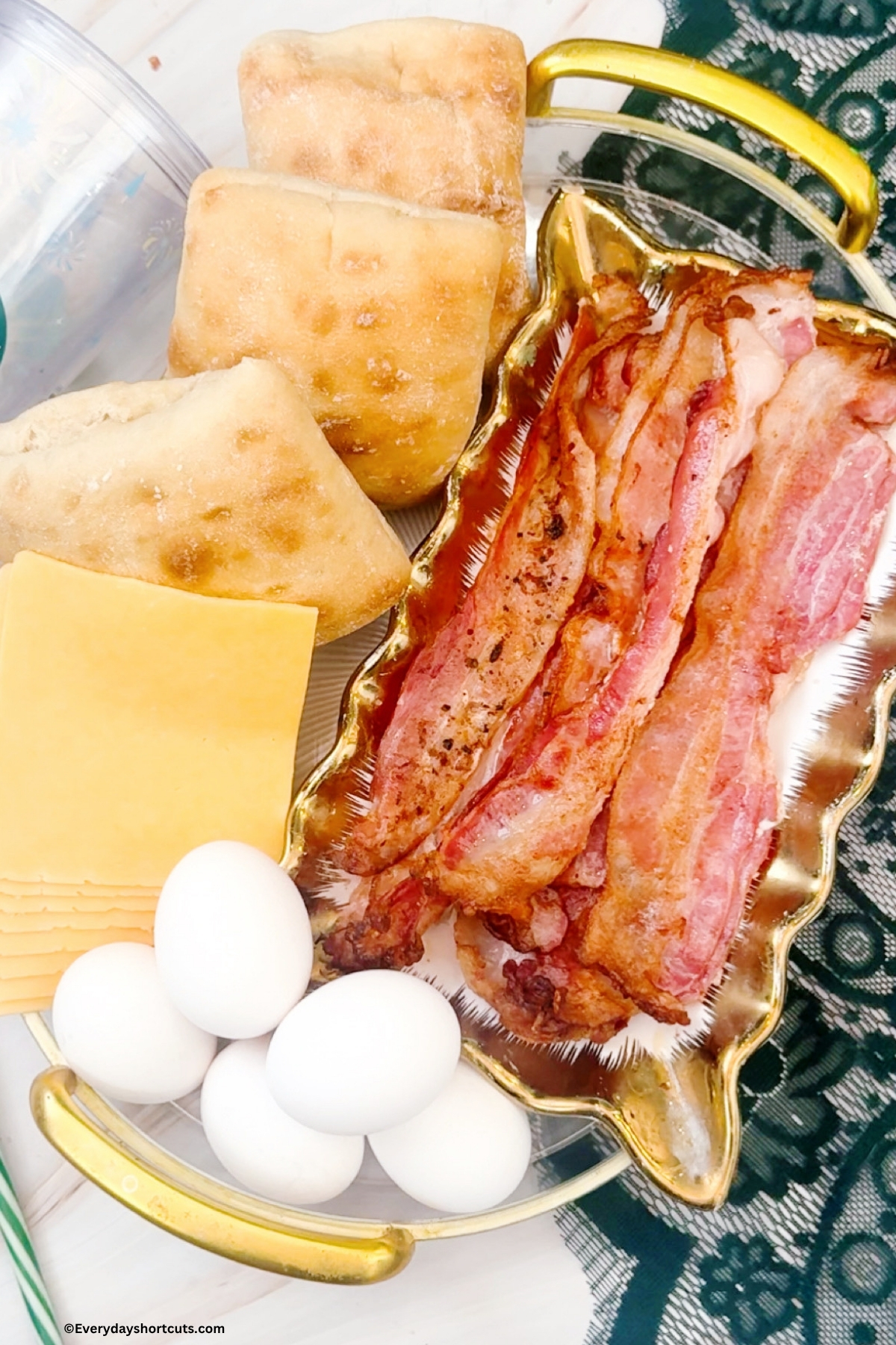 ingredients shown: ciabatta buns, bacon, cheese slices, eggs