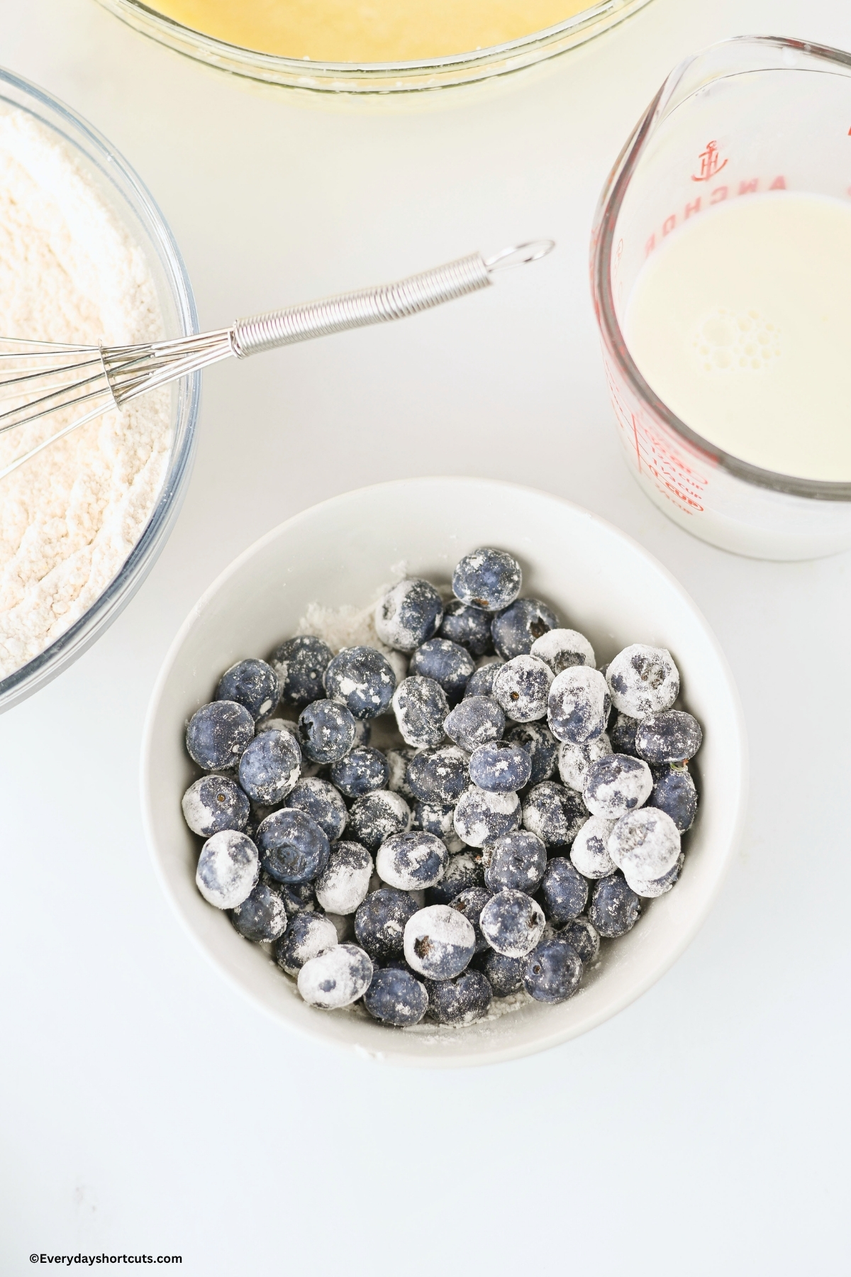 blueberries in a bowl covered in flour