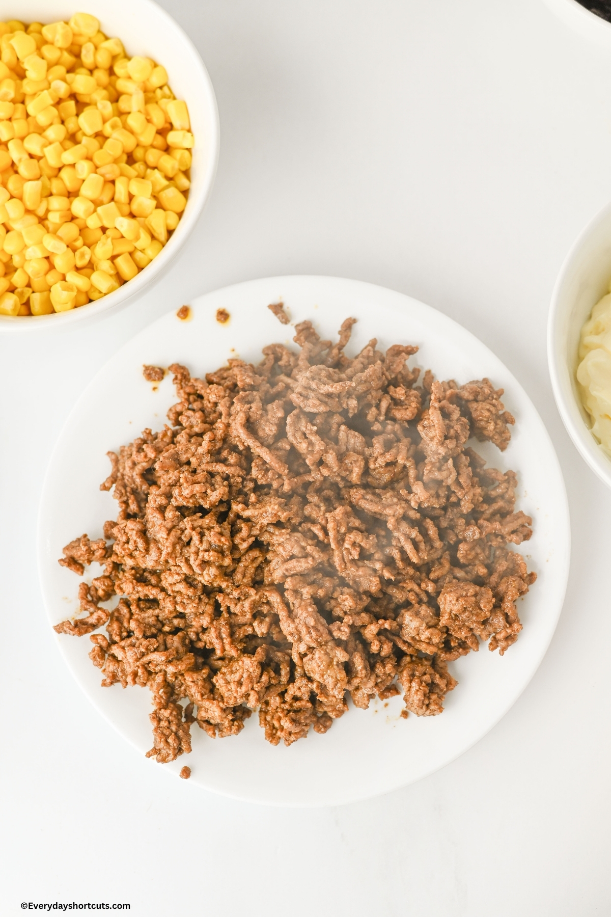 cooked ground beef on a white plate