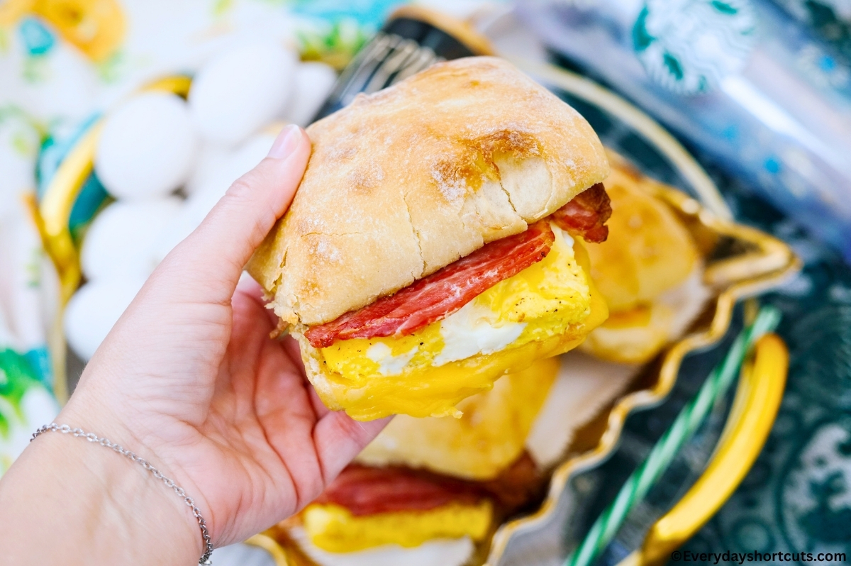 holding a copycat Starbucks bacon gouda breakfast sandwich