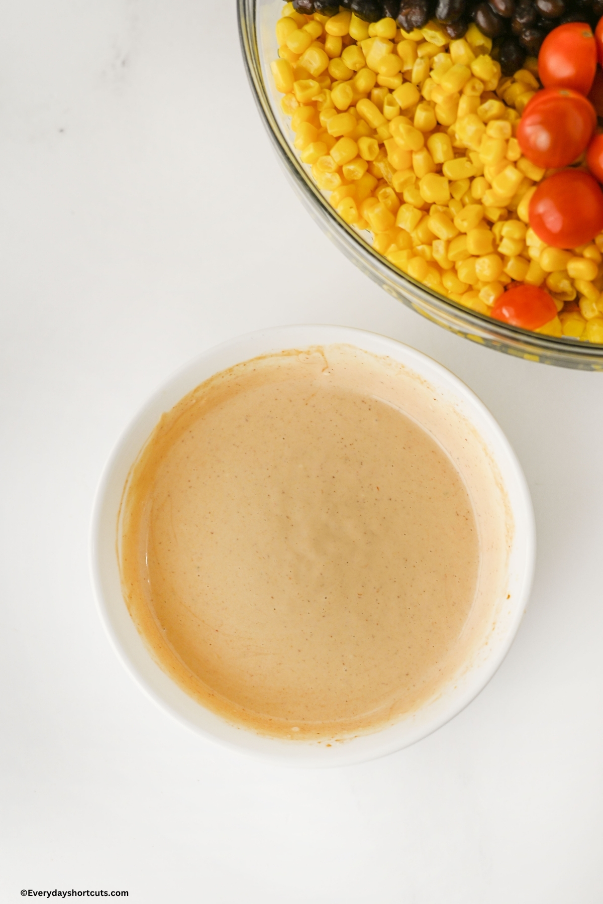 creamy tangy dressing in a white bowl