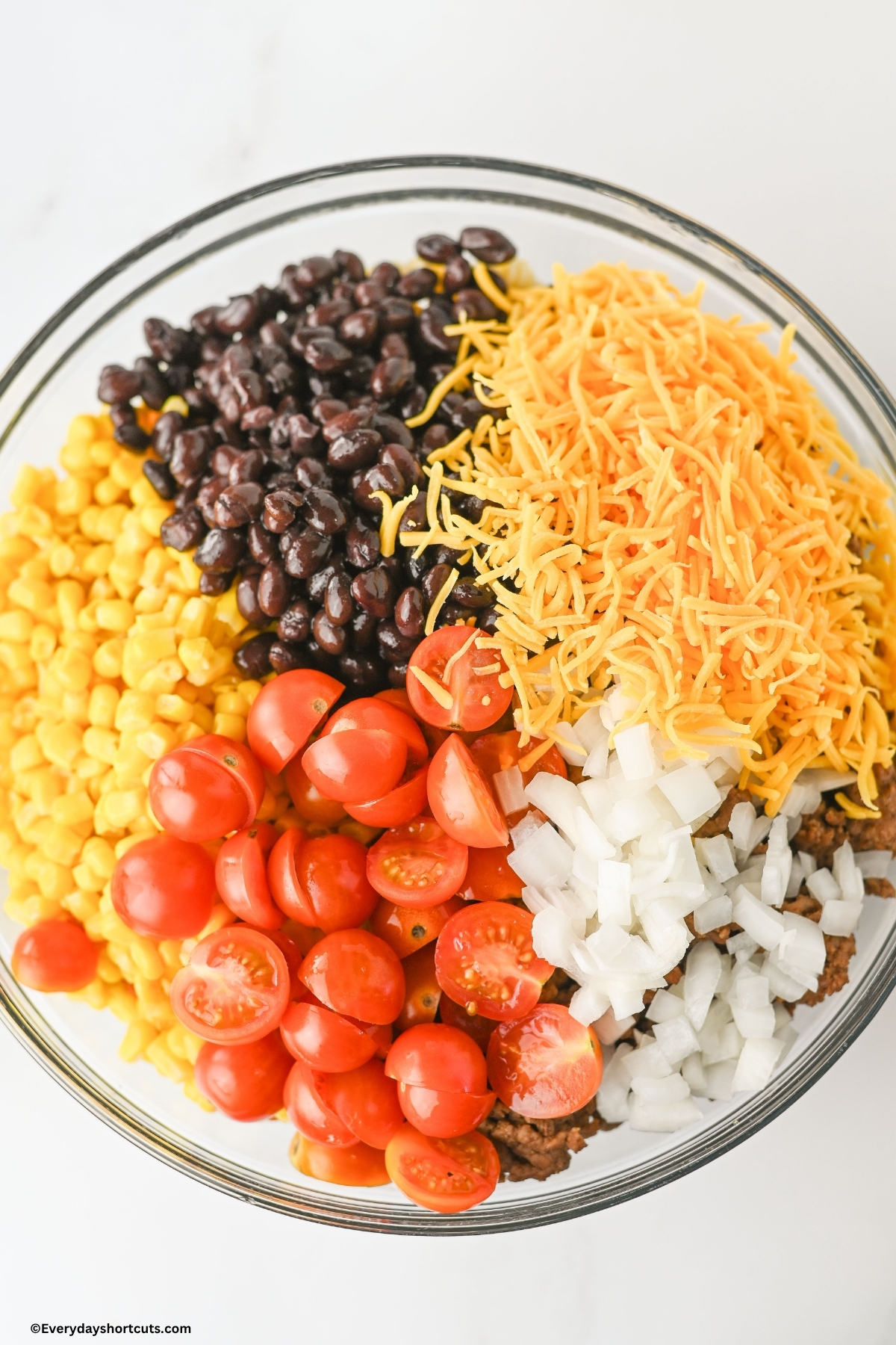 cowboy pasta salad ingredients in a bowl