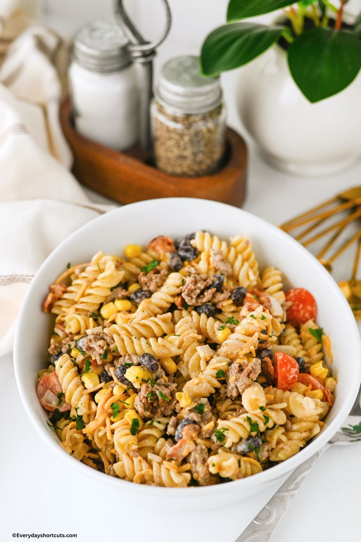 up close of cowboy pasta salad in a white bowl